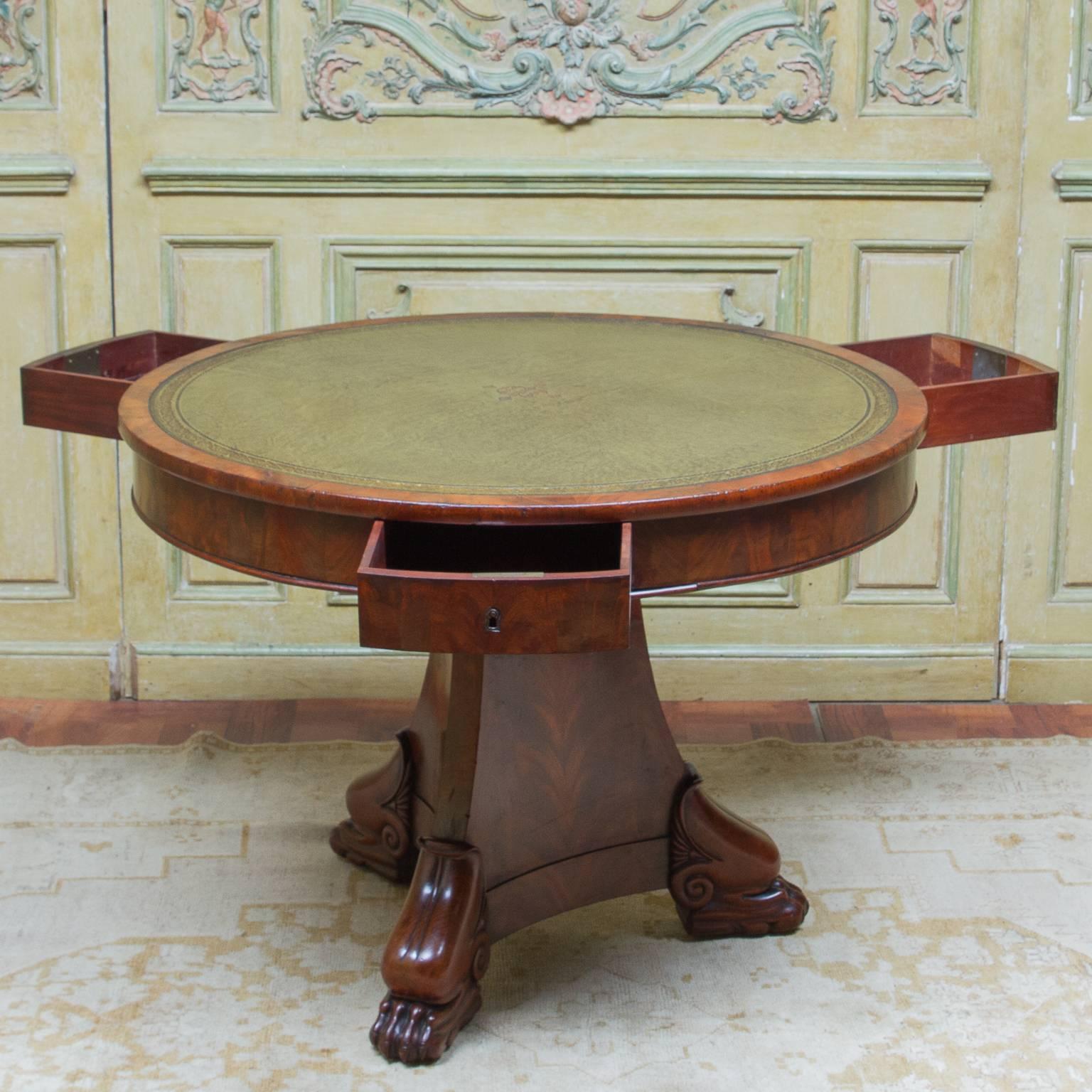 A fine Empire center table with three locking drawers. An amazing tooled leather inserted top. Incredible mahogany base. Superb quality and functional, circa 850. From France.

 

38.5 diameter

 

28.5 tall

 

Can be raised from the