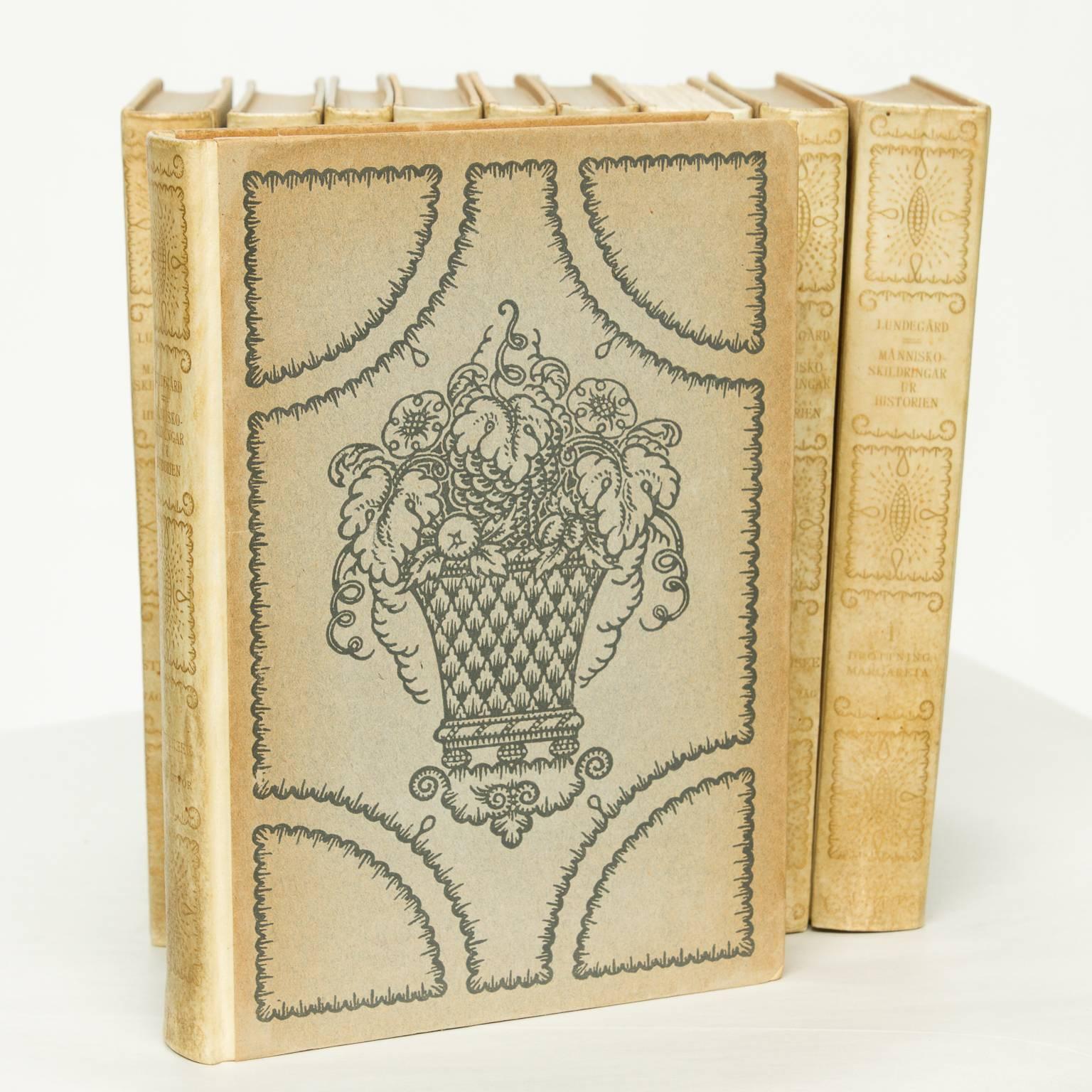 Set of ten Swedish leather bound books in a tan to light green finished leather. Very nice embossed paper sides having a fruit basket design.