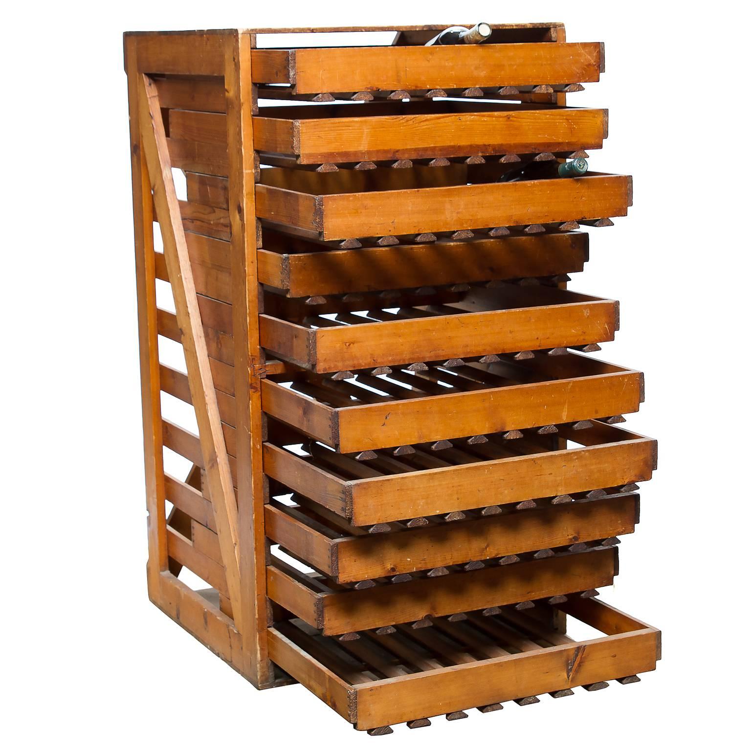 Vintage English apple and pear shop storage piece. Ten pullout shelves each functional very well. Made from pine which has aged well wonderful coloring. Great storage for wine and a great look.