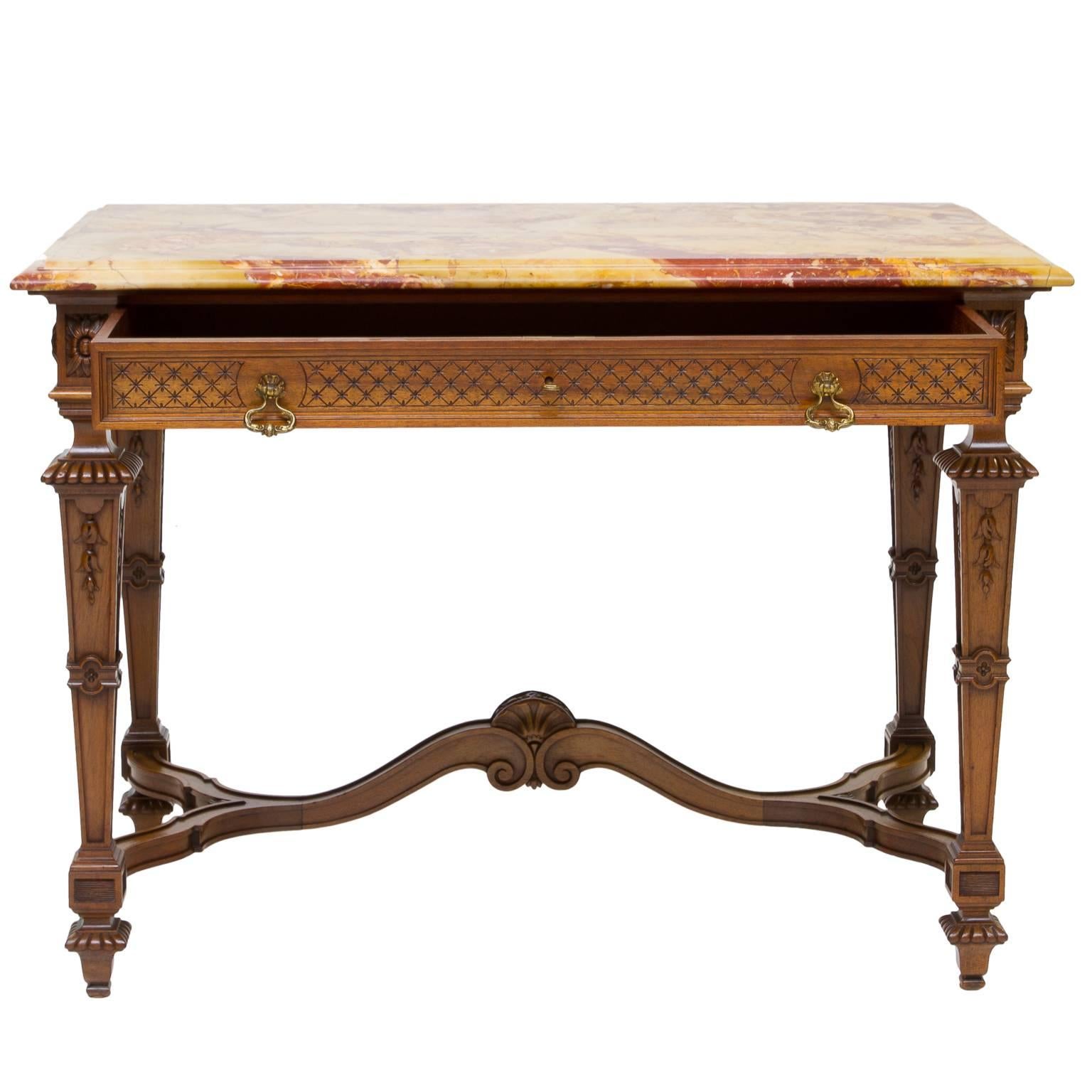 19th Century, French Renaissance style marble-top table with drawer. Made from French walnut wood and Brèche de Montmeyan marble. The apron has a single large drawer and two bronze decorative pulls. Notice the detail on the apron called diaper