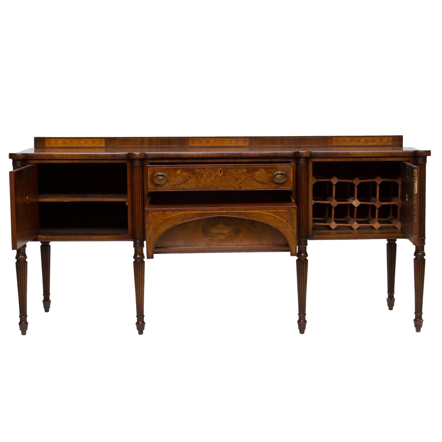 19th century English inlaid sideboard with a step up back. This sideboard has wood inlay to the front and sides. Very intricate inlay. The sides have a large fan inlays. The front has figural characters, Floral, leaf and vine, quarter fan and an