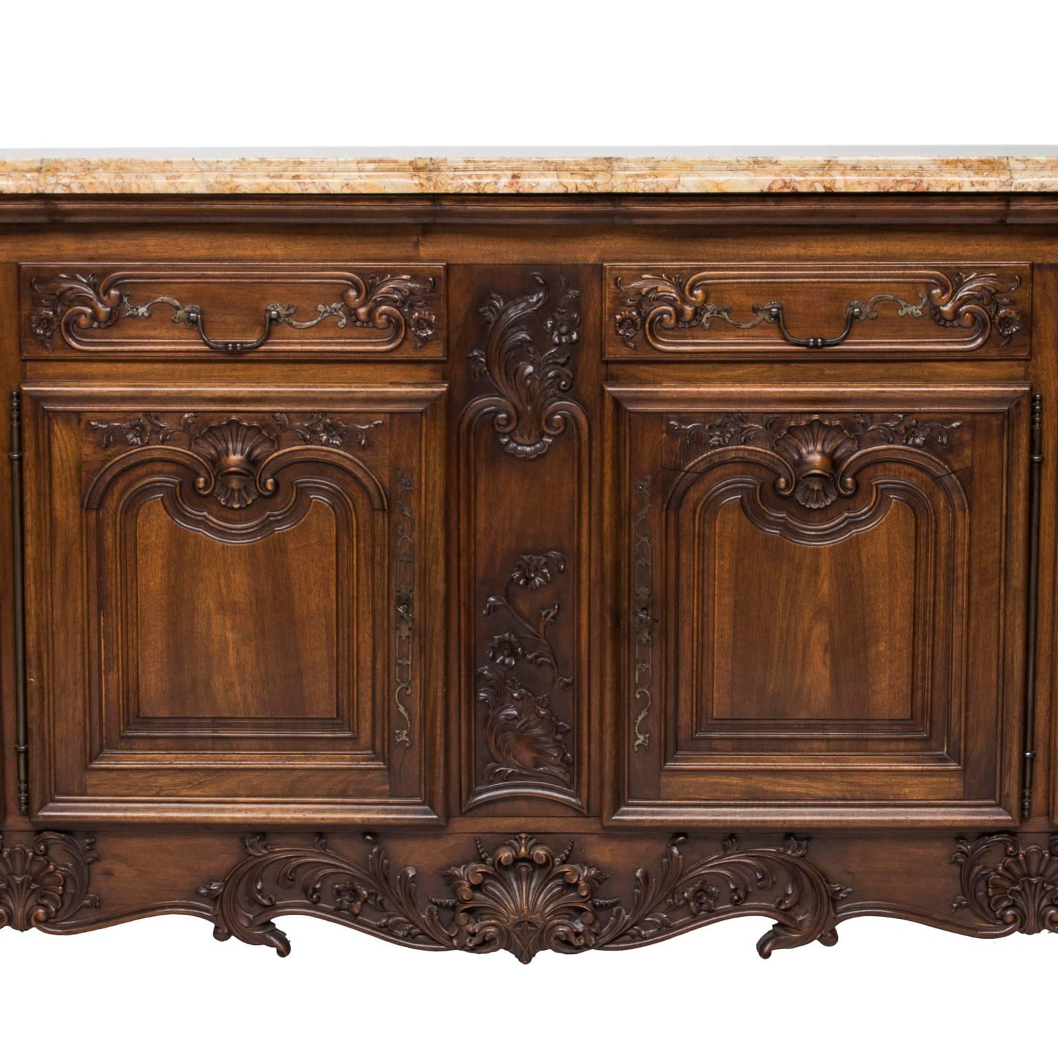 A striking and import Louis XV marble top enfilade from the city of Lyon. Lyonnaise furniture is considered by some to be the best craftsmanship from France. This piece is an example of the inherent qualities. Beautiful walnut, a choice stock.