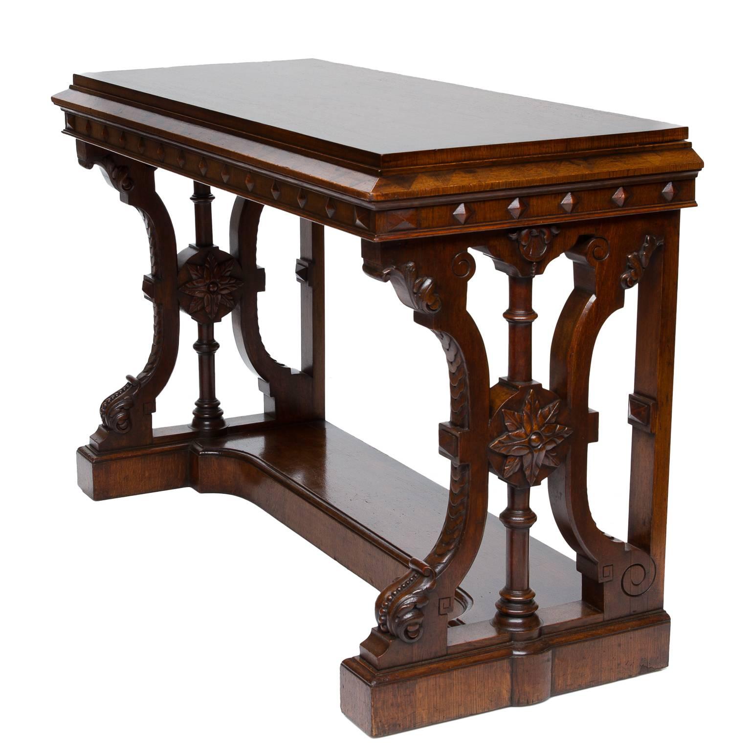 An extraordinary 19th century English inlaid console table. A geometrical parquetry inlaid top with contrasting inlay into thick oak veneer on mahogany wood. Sloped edge moulding front and sides with parquetry inlaid triangles. Under the moulding,