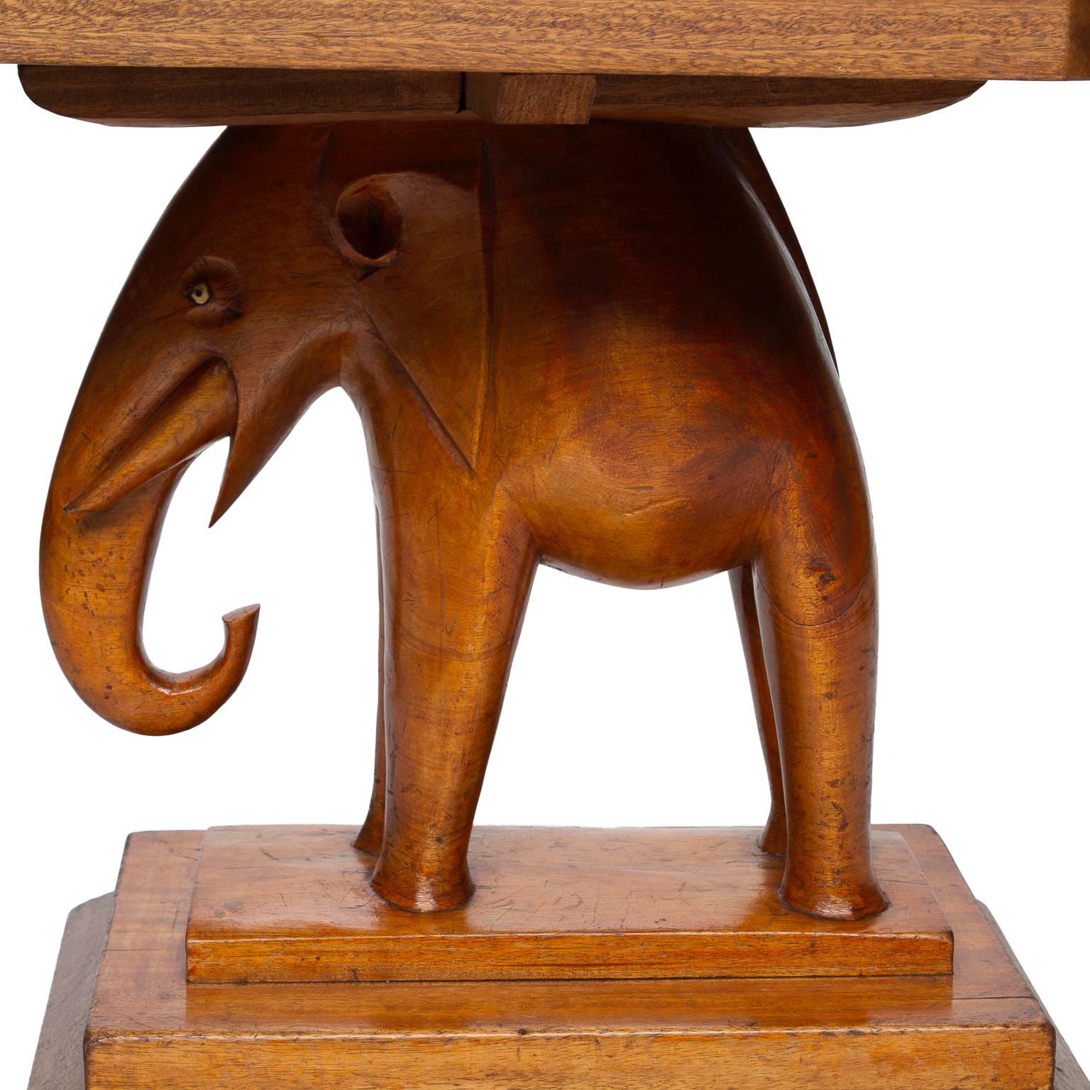 A different side table. An Ashanti table with carved base. Wonderful patina and detailed carving. Sets up upon a stacked base and very sturdy. The top has been replaced but blends very well. Made most likely in Africa.