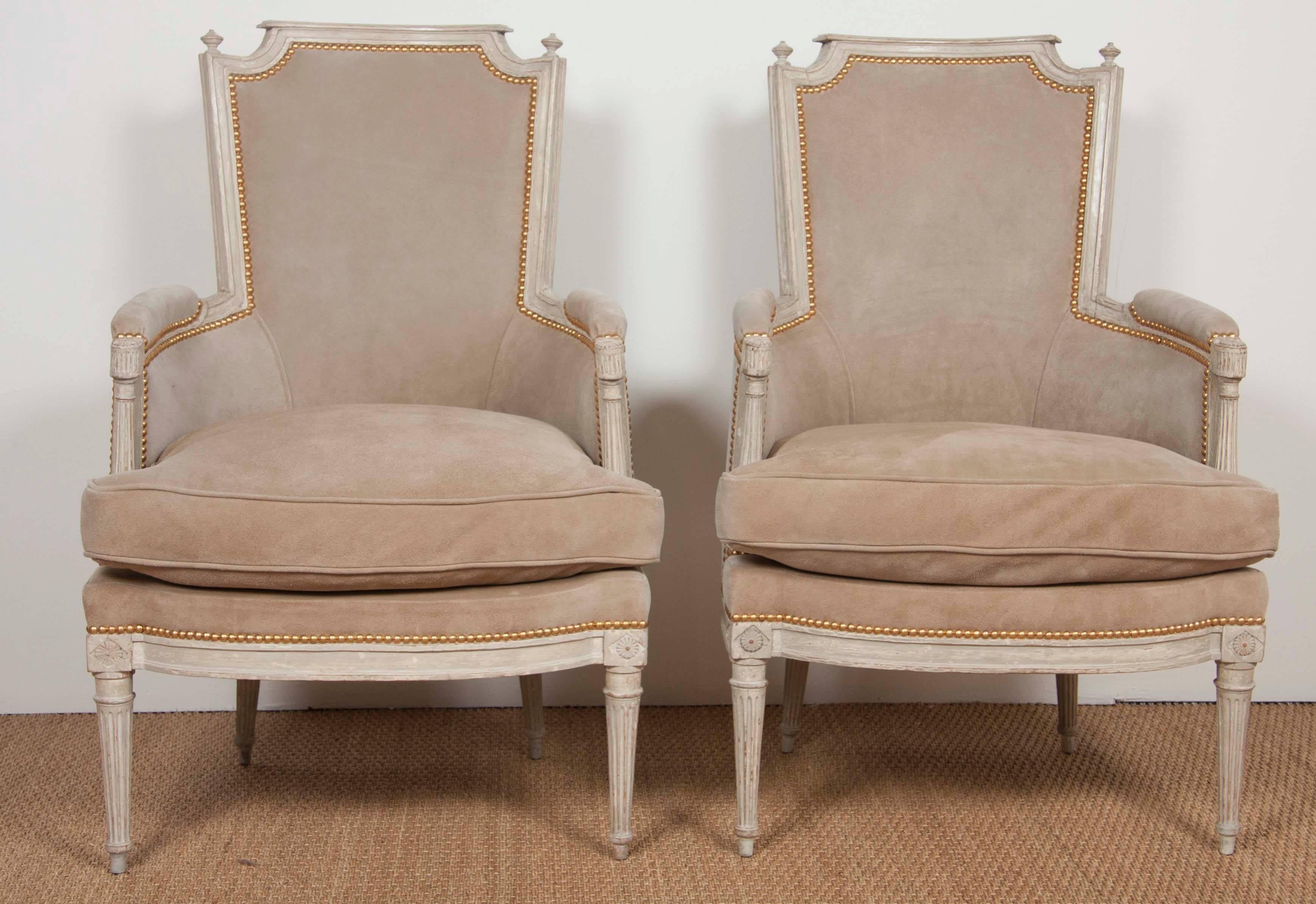 A late 18th-early 19th century pair of Swedish bergere form painted chairs now smoothed and waxed.