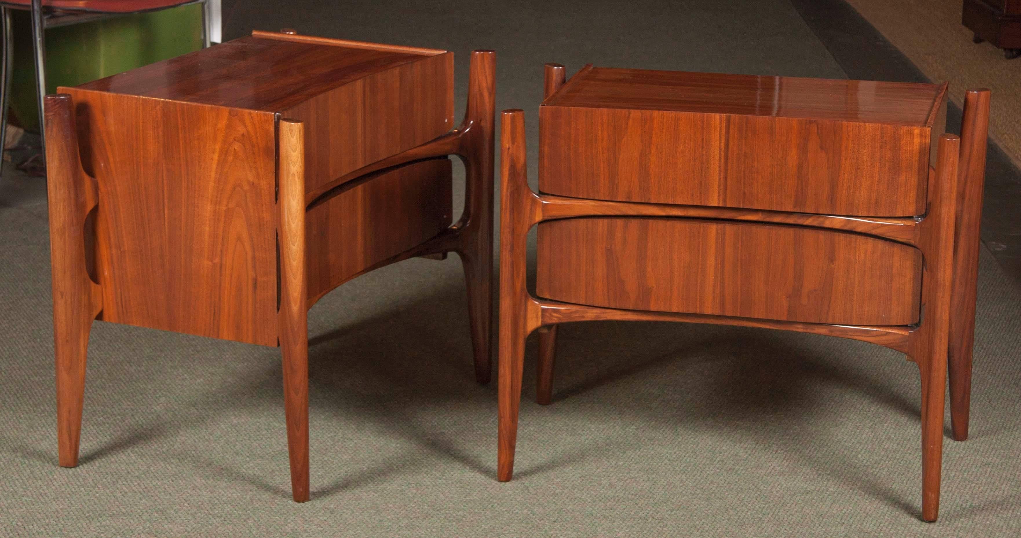 A pair of walnut bedside tables designed by Edmond Spence. Marked Swedish. Produced in Sweden by the Swedish Furniture Guild.