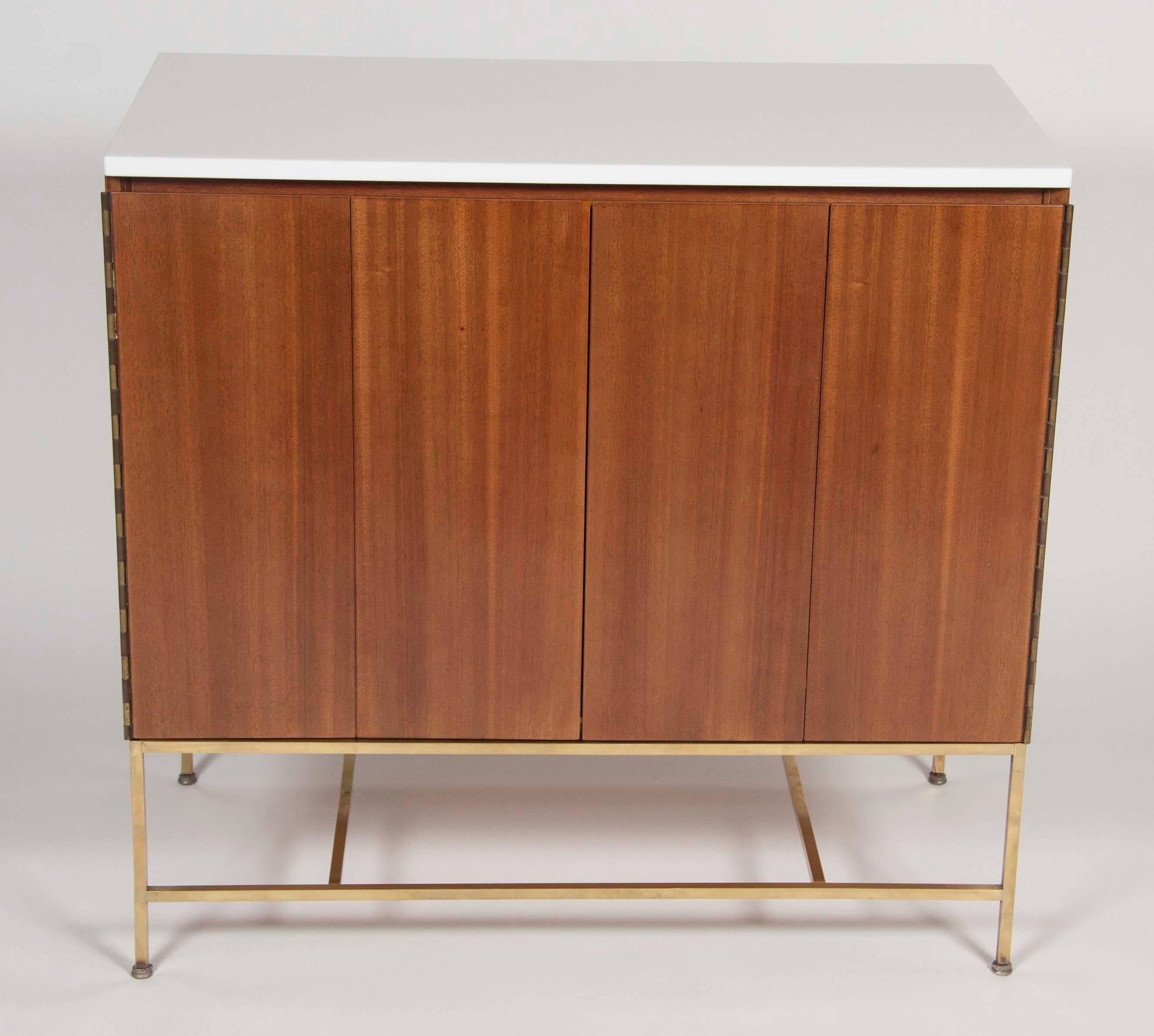 Modern A Pair of Paul McCobb Cabinets with Vitrolite Glass Tops And Brass Stretchers
