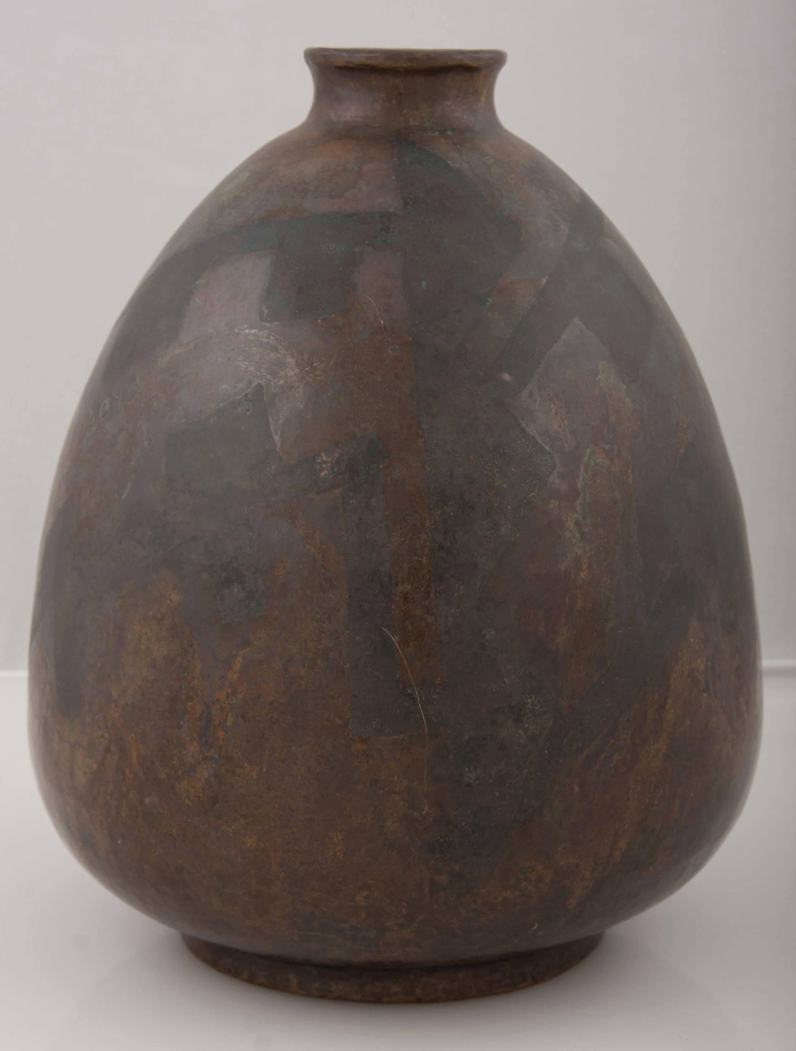 A tear drop shape Paris Art metal vase with turned rim. Marked 