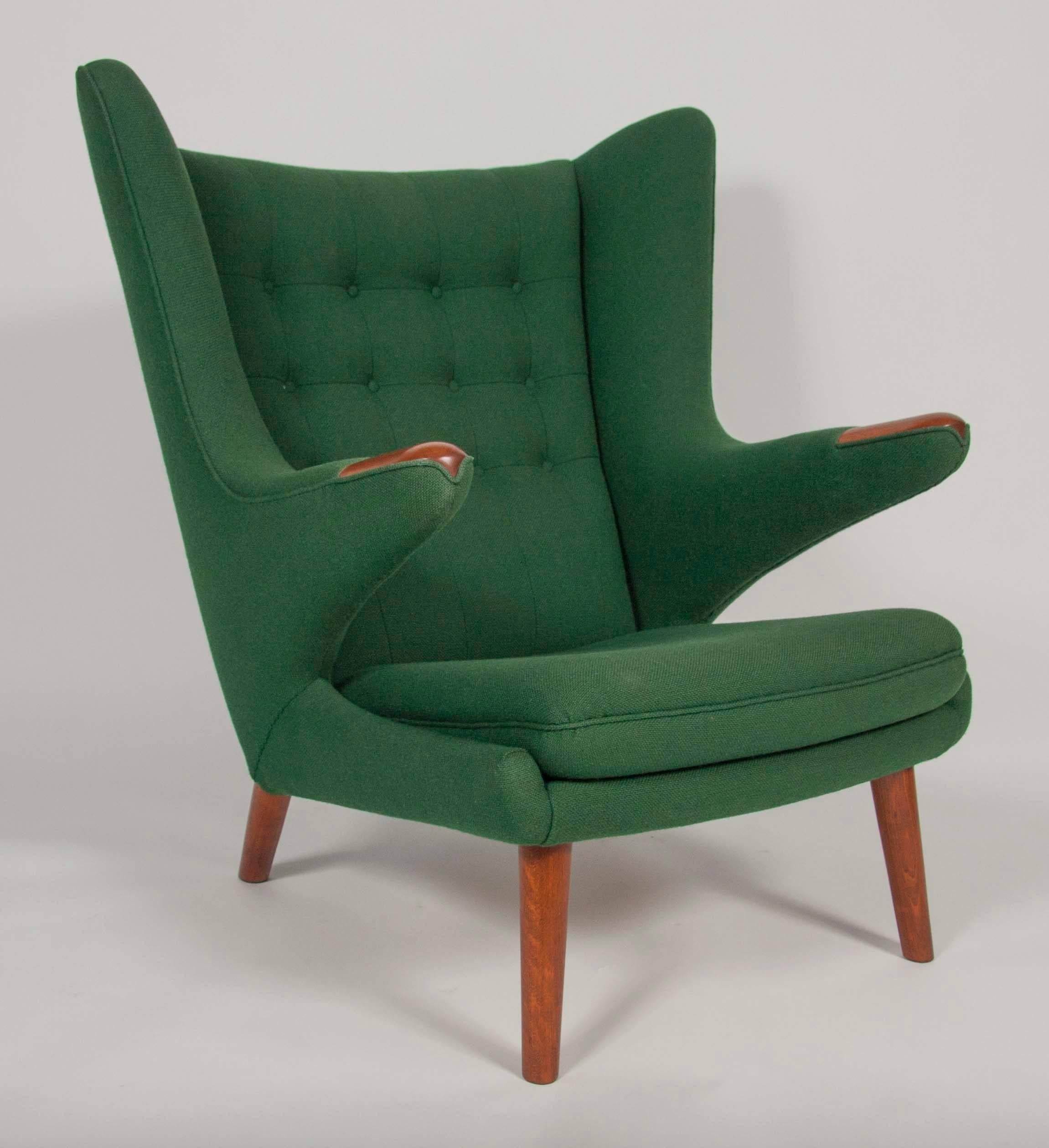 For your consideration is a pair of Hans Wegner for AP Stolen Papa Bear chairs, reupholstered in emerald green. These chairs are icons of Danish Modern design, from one of the movement’s masters. The chairs are in excellent condition and go well