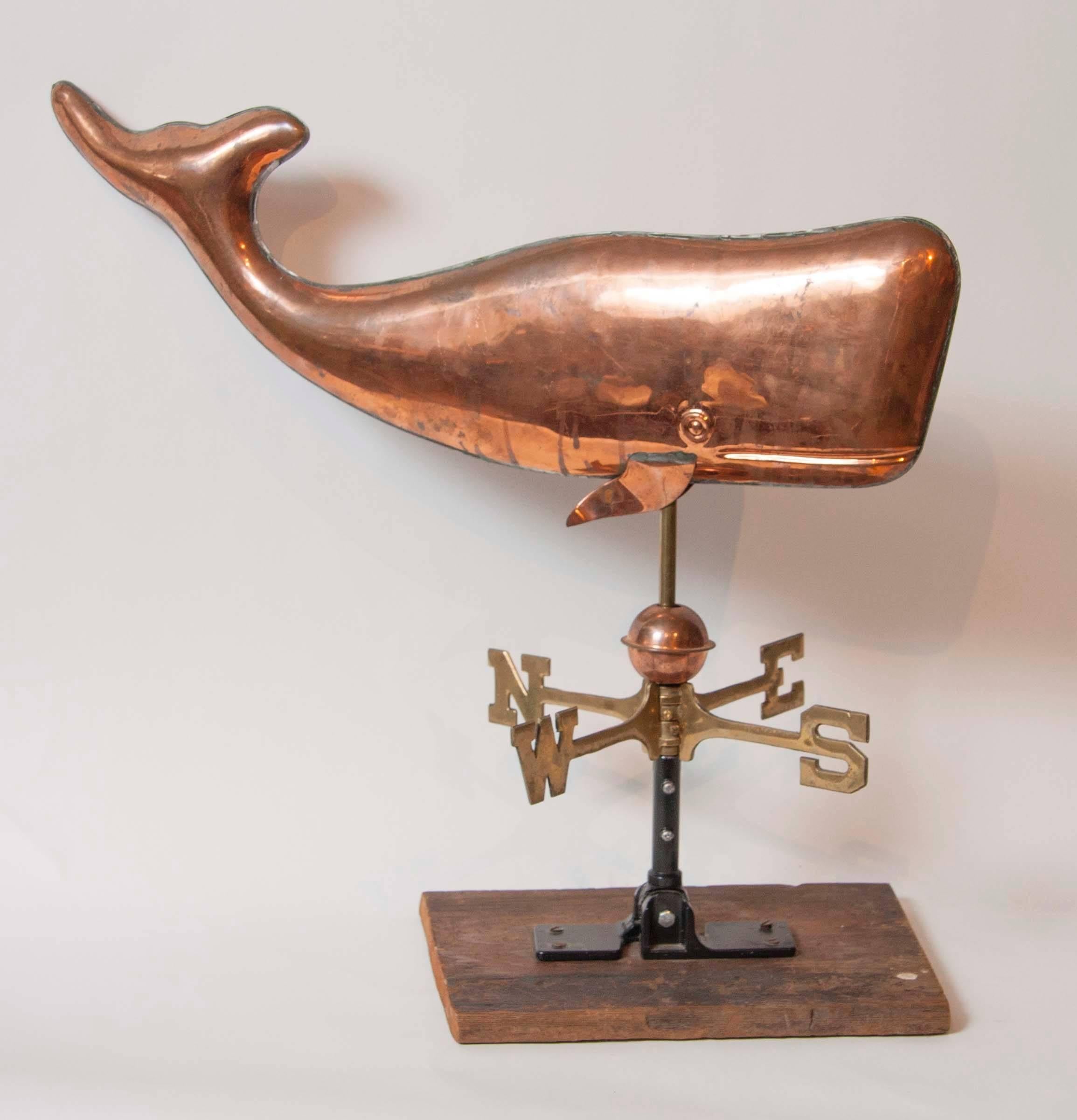A wonderful copper weathervane in the form of a whale.