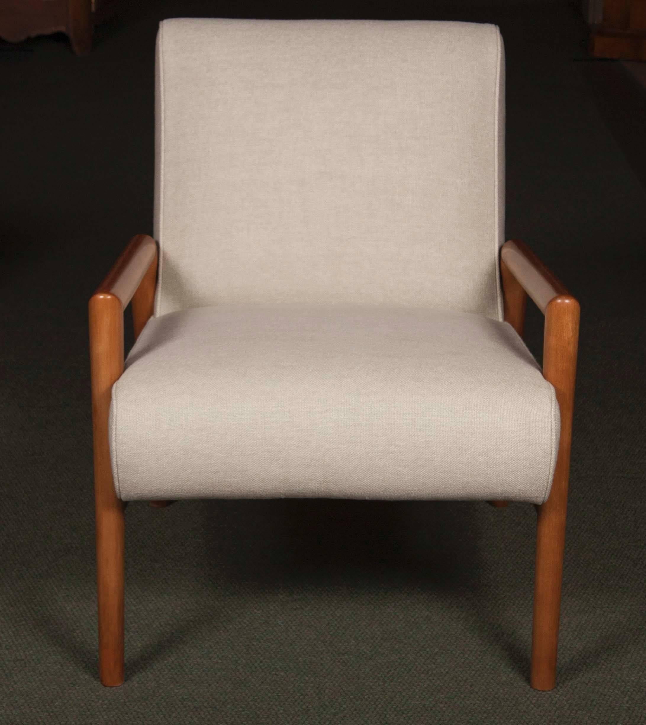 A Mid-Century bleached Mahogany open armchair designed by Leslie Diamond for Connant and Ball. Pair Available, upholstered and priced individually.