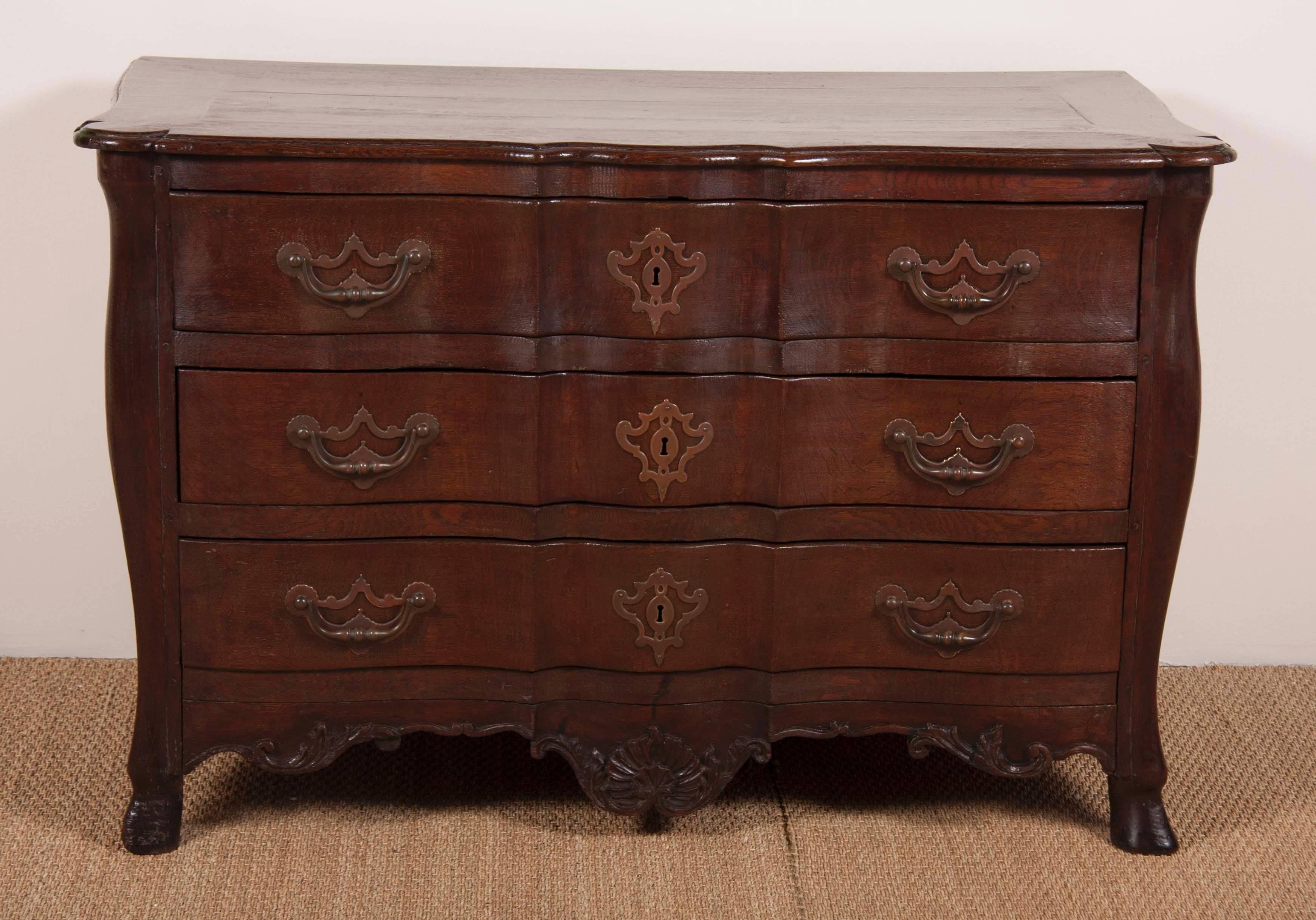 A wonderfully robust Louis XV Provincial bureau in oak with original hardware.