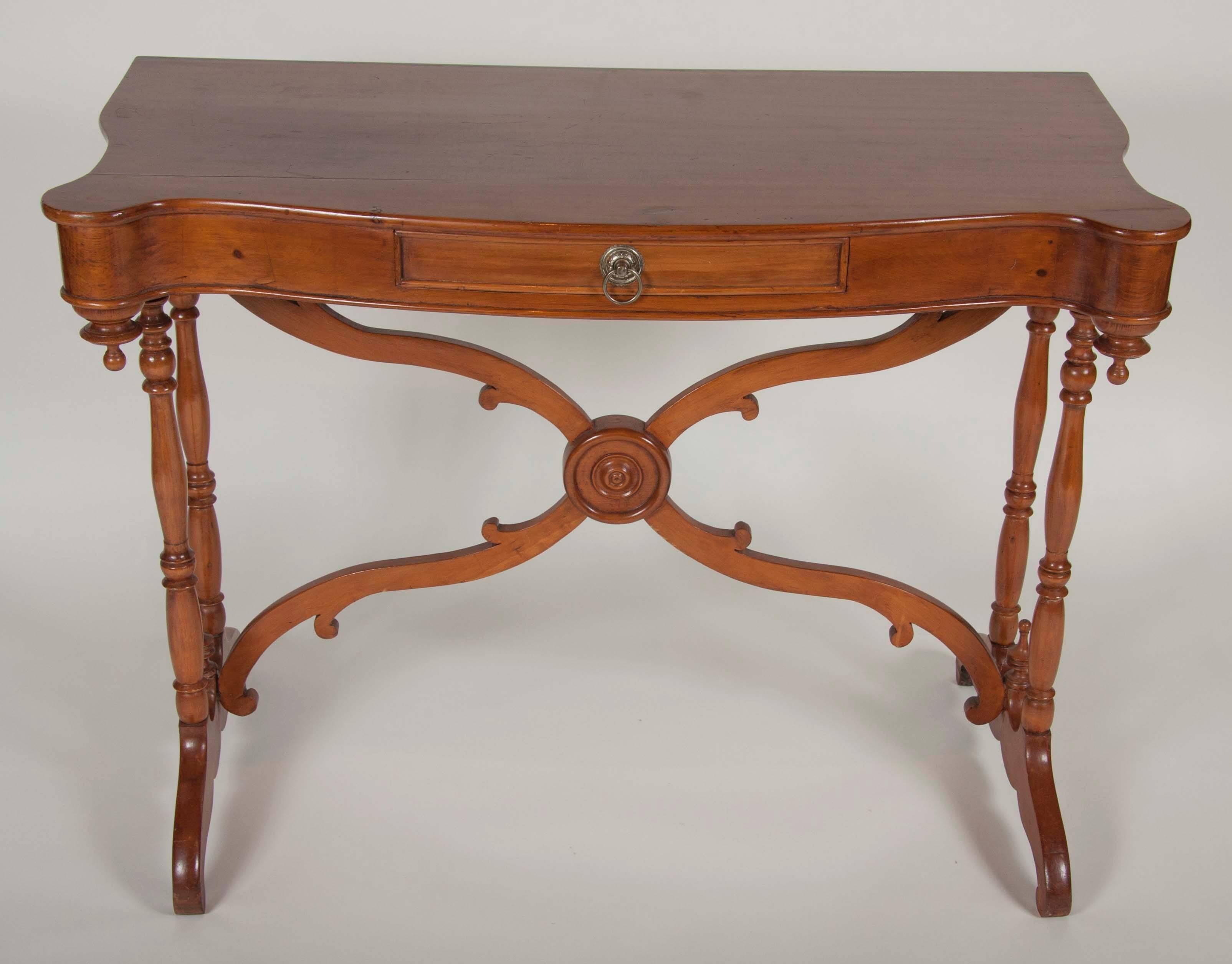 A pair of 19th century maple consoles with turned legs.