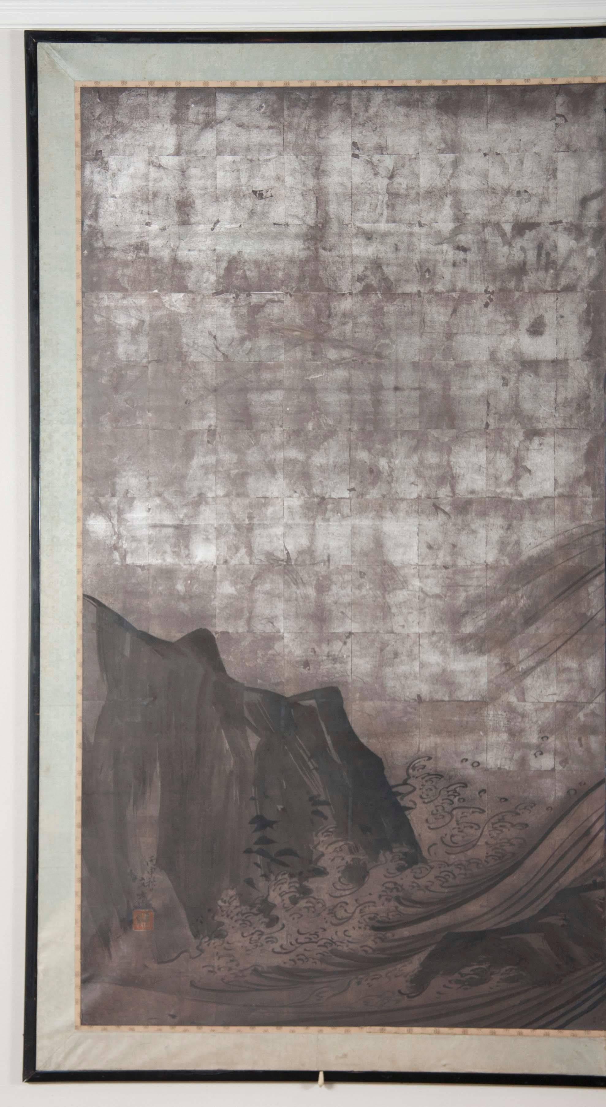 A Japanese two-panel screen from the Kano School Byobu, with silver leaf and rolling waves.