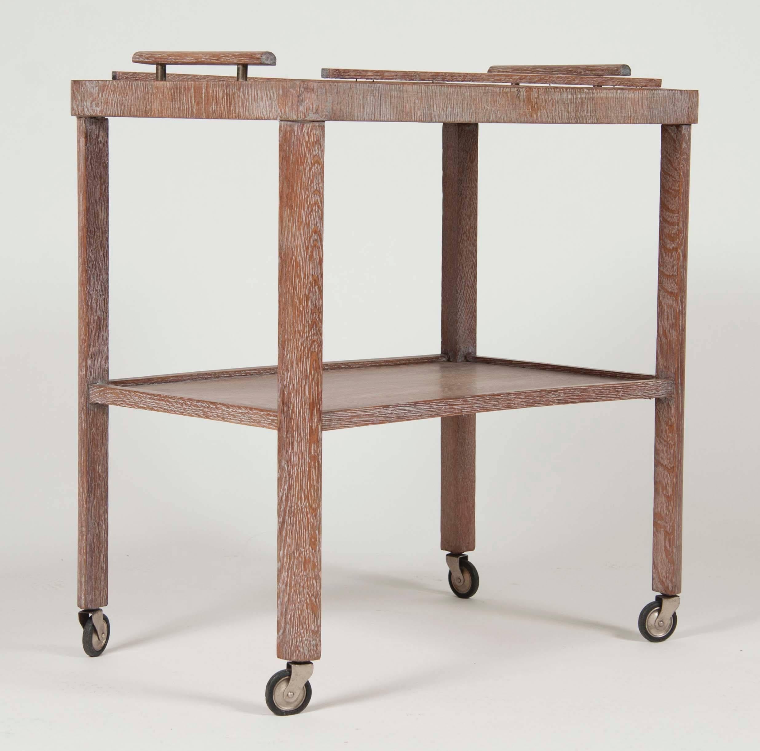 A French, limed oak, Mid-Century, two-tiered serving cart.