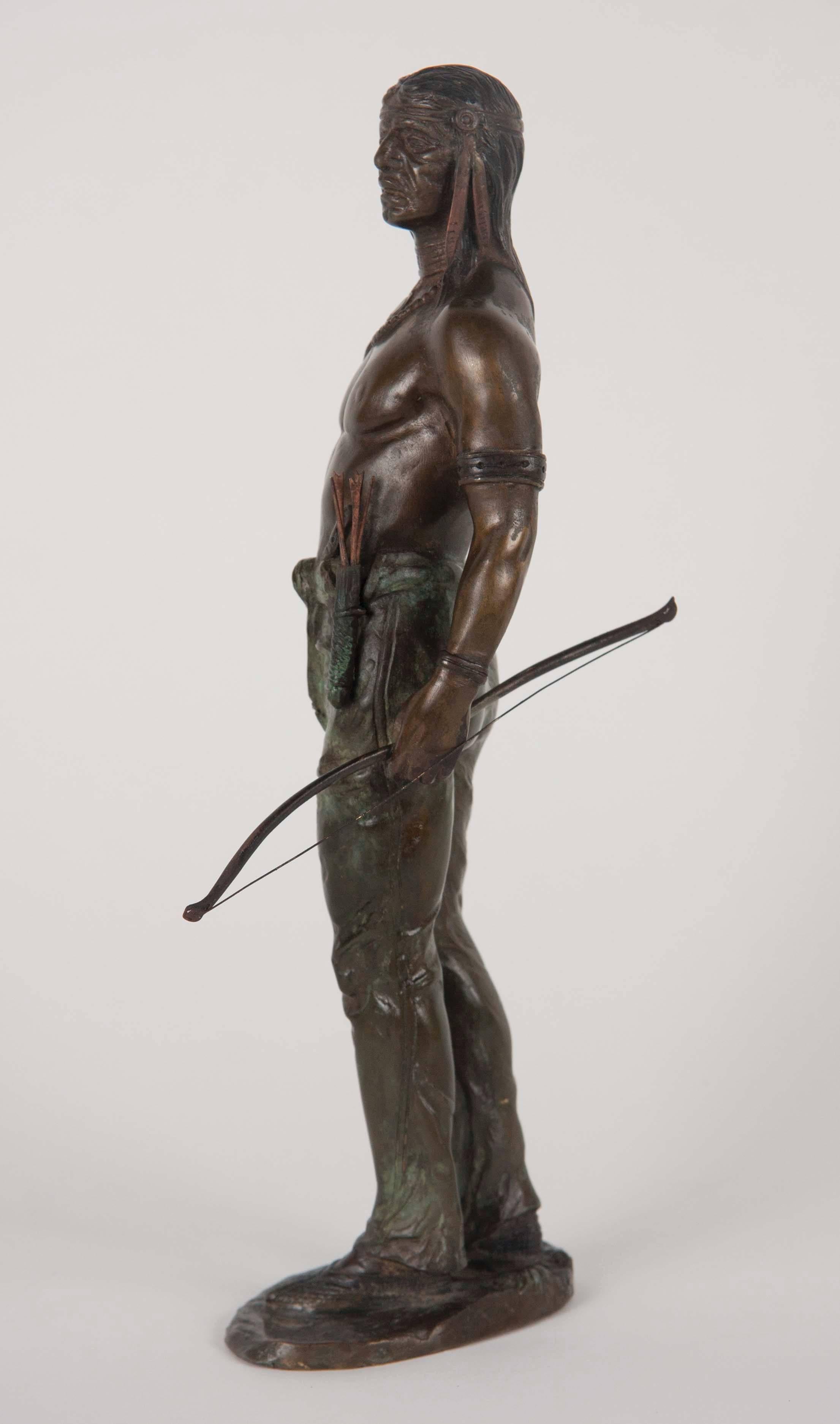 Carl Kauba bronze of standing Indian brave with bows and arrows; 
signed C. Kauba.