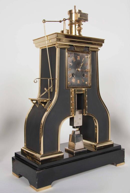 A handsome 19th century French clock set comprising a clock with a matching pair of candelabrum. French Industrial steam Hammer type with brass movement. Signed GLT Paris Japy Freres.
              
