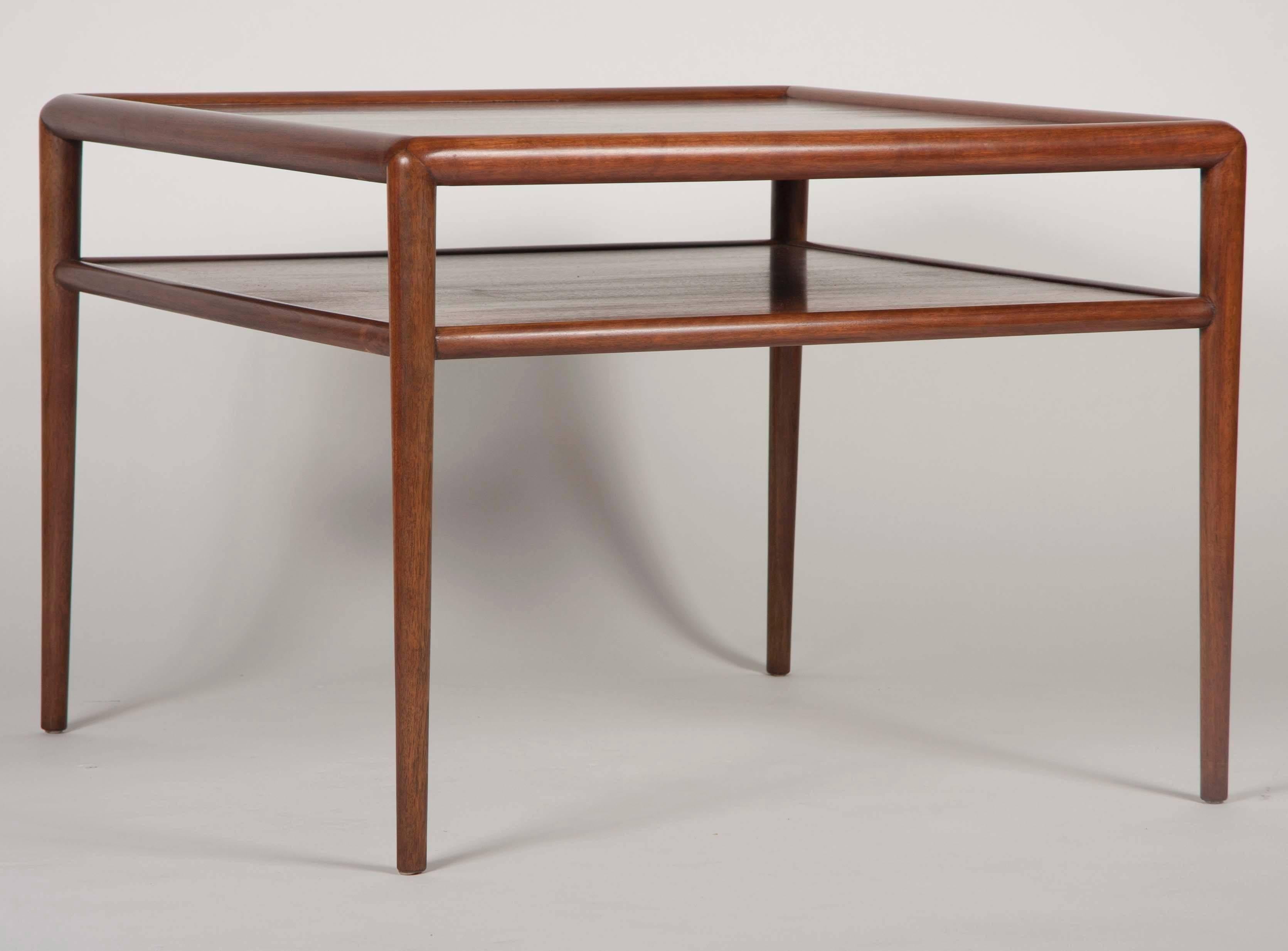 A two-tier T.H. Robsjohn-Gibbings walnut side table - coffee table. Fully restored and labeled Gibbings for Widdicomb.