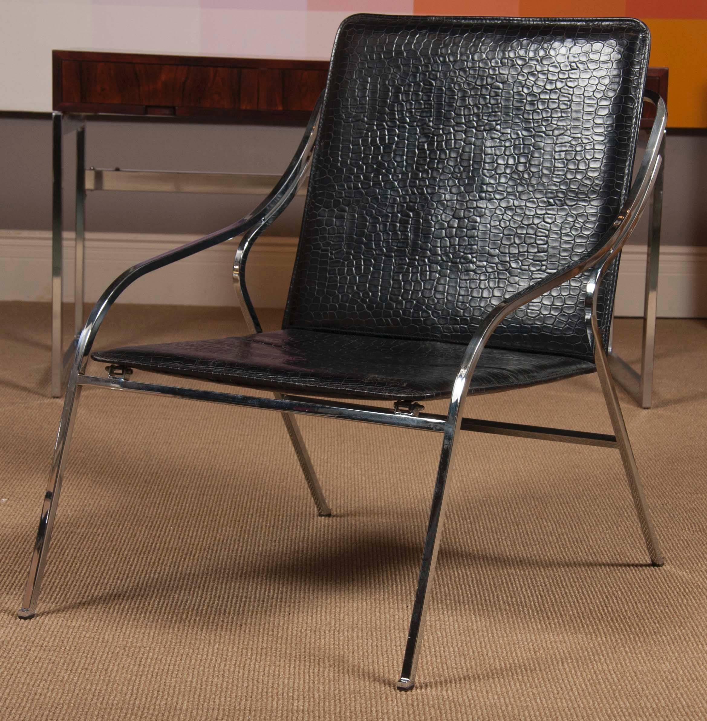 A pair of Italian chrome lounge chairs with faux alligator leather upholstery. Showing influences of Danish designer, Poul Kjaerholm.