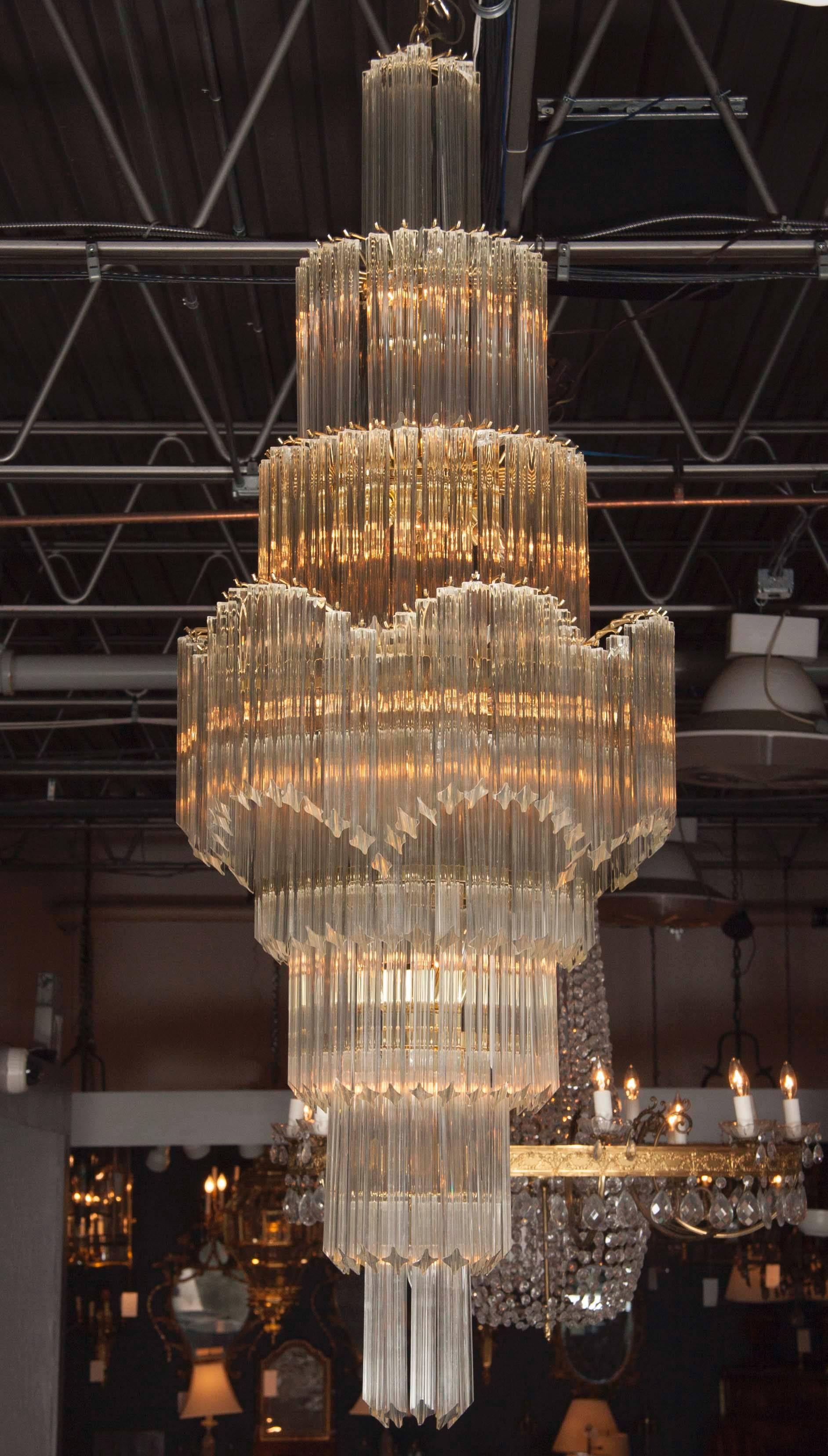A stunning, monumental Mid-Century Modern Italian 'Wedding Cake', eight-tier cascading crystal chandelier; featuring Camer glass prism's each measuring 11.25