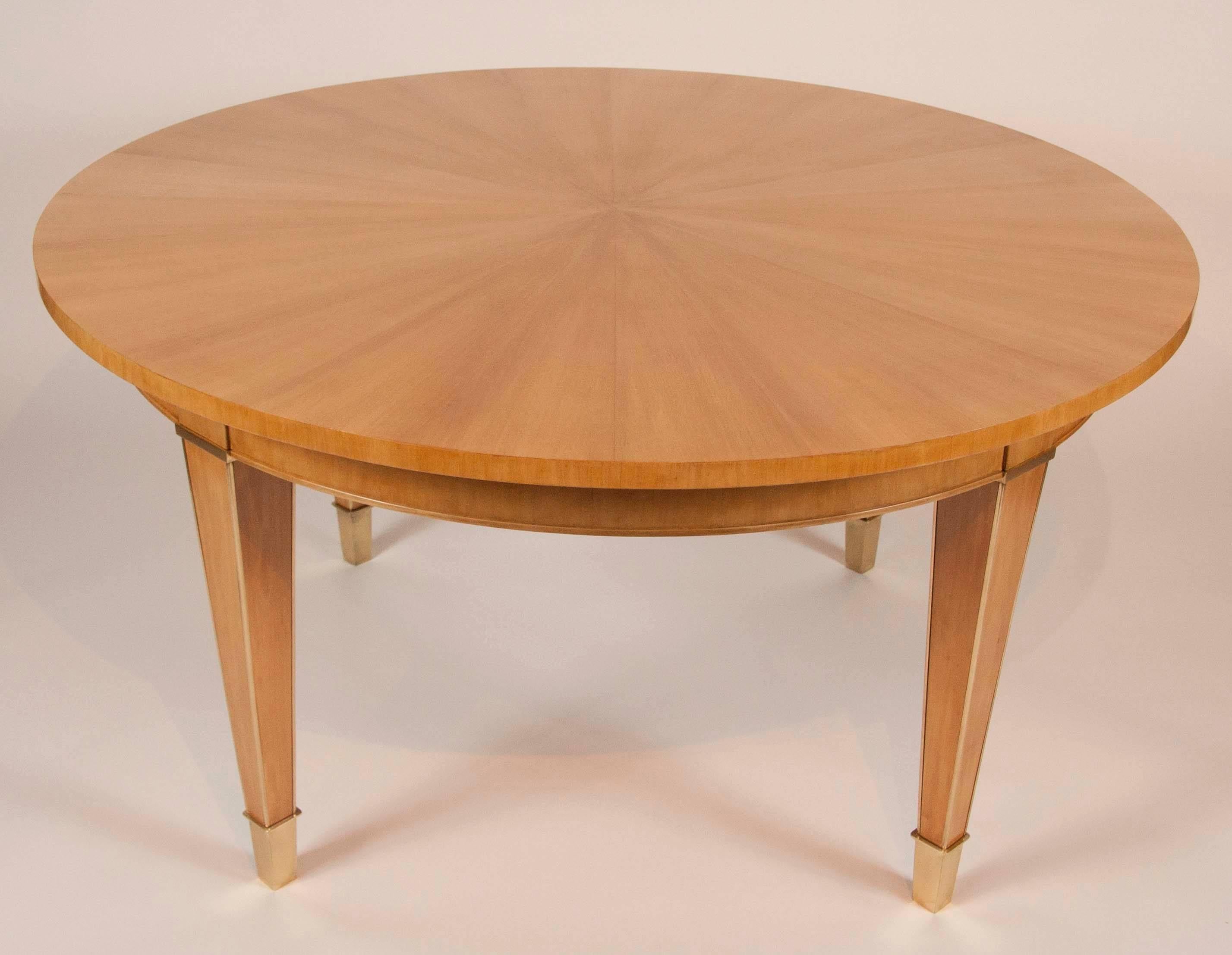 A French Sycamore table with gilt bronze mounts in the style of Andre Arbus.
   