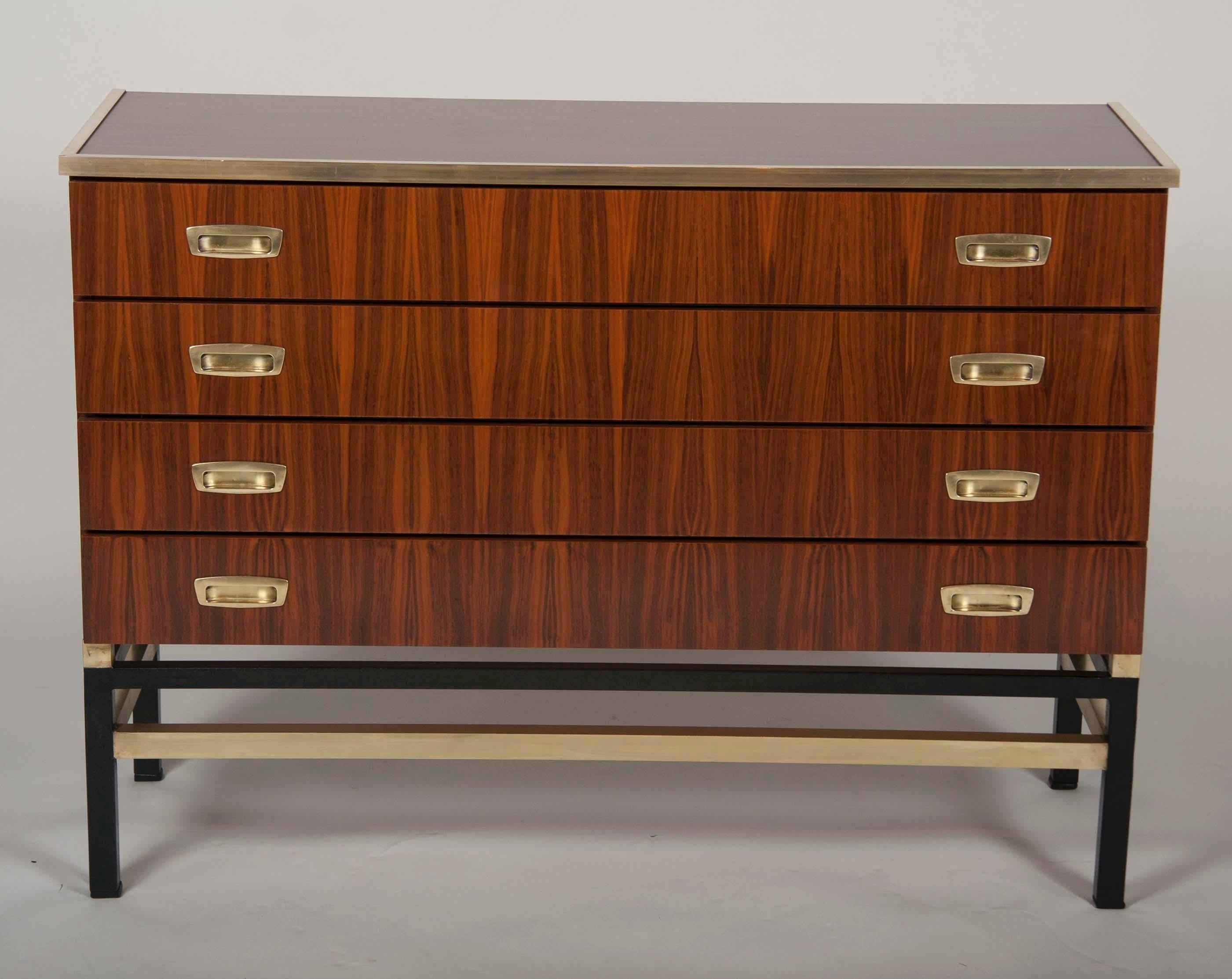 A Mid-Century Italian kingwood four-drawer commode or chest of drawers with brass pulls and trim.