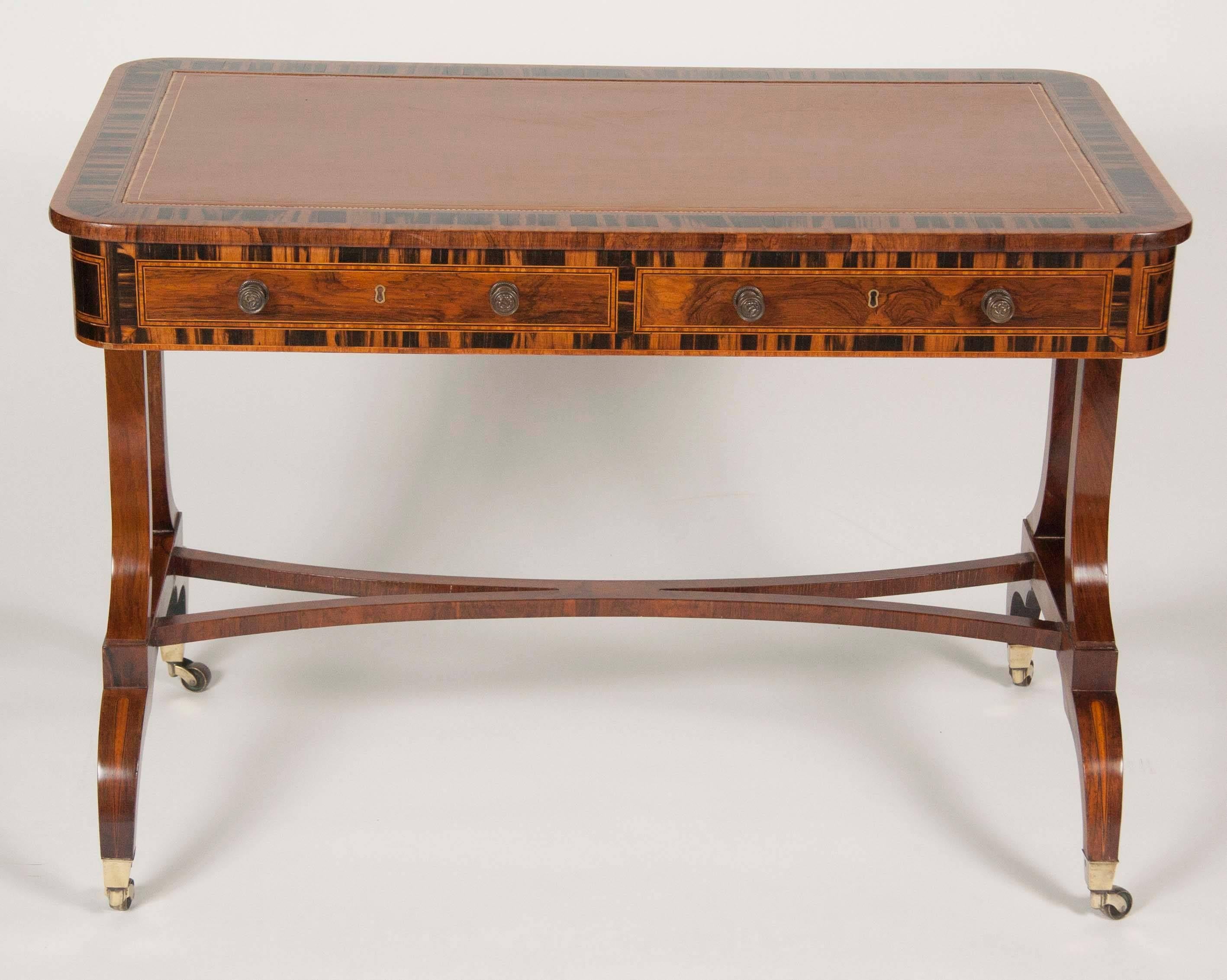 A Regency rosewood and calamander library table of exquisite form and execution.