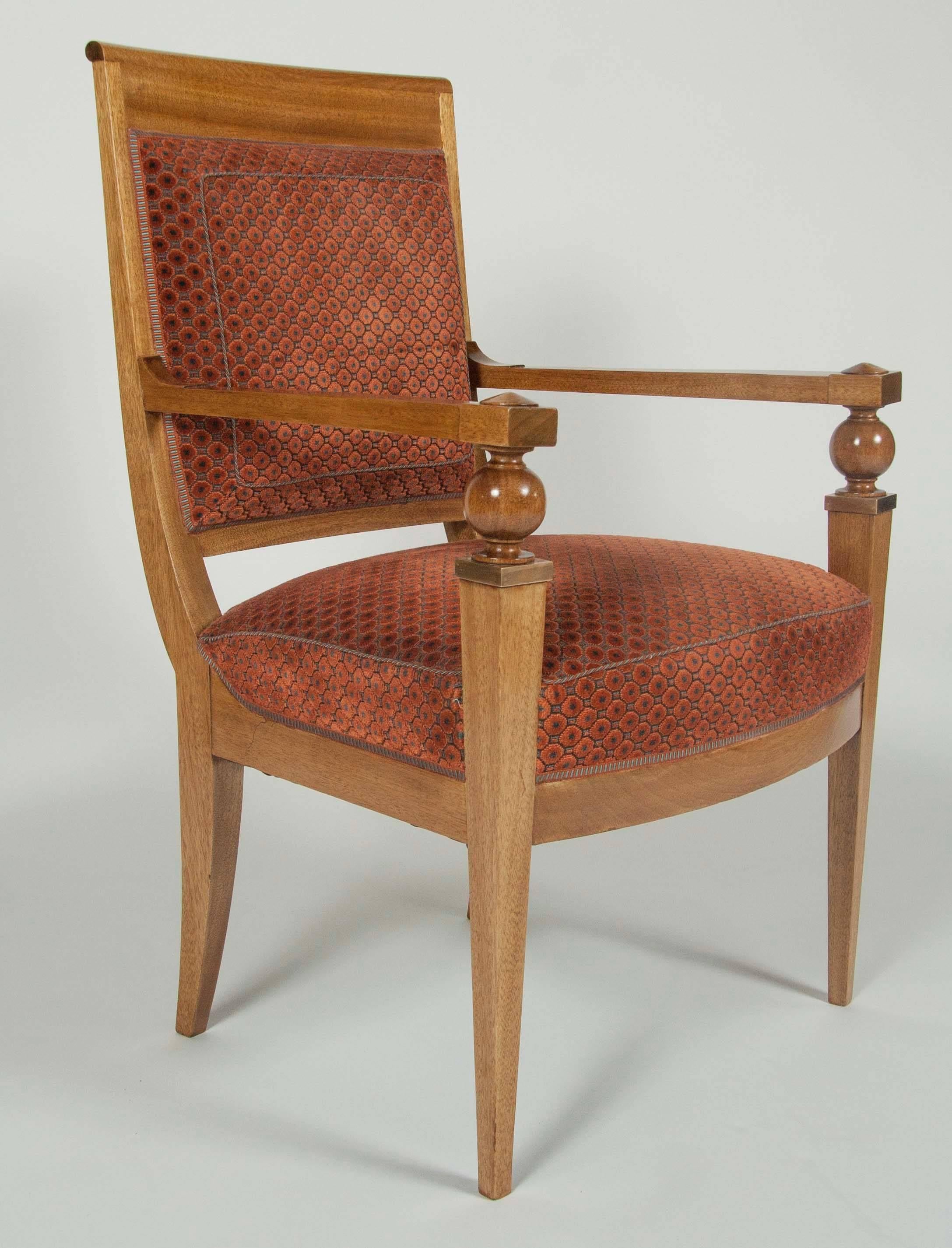 A pair of French walnut fauteuil with bronze mounts in the manner of Andrea Arbus.