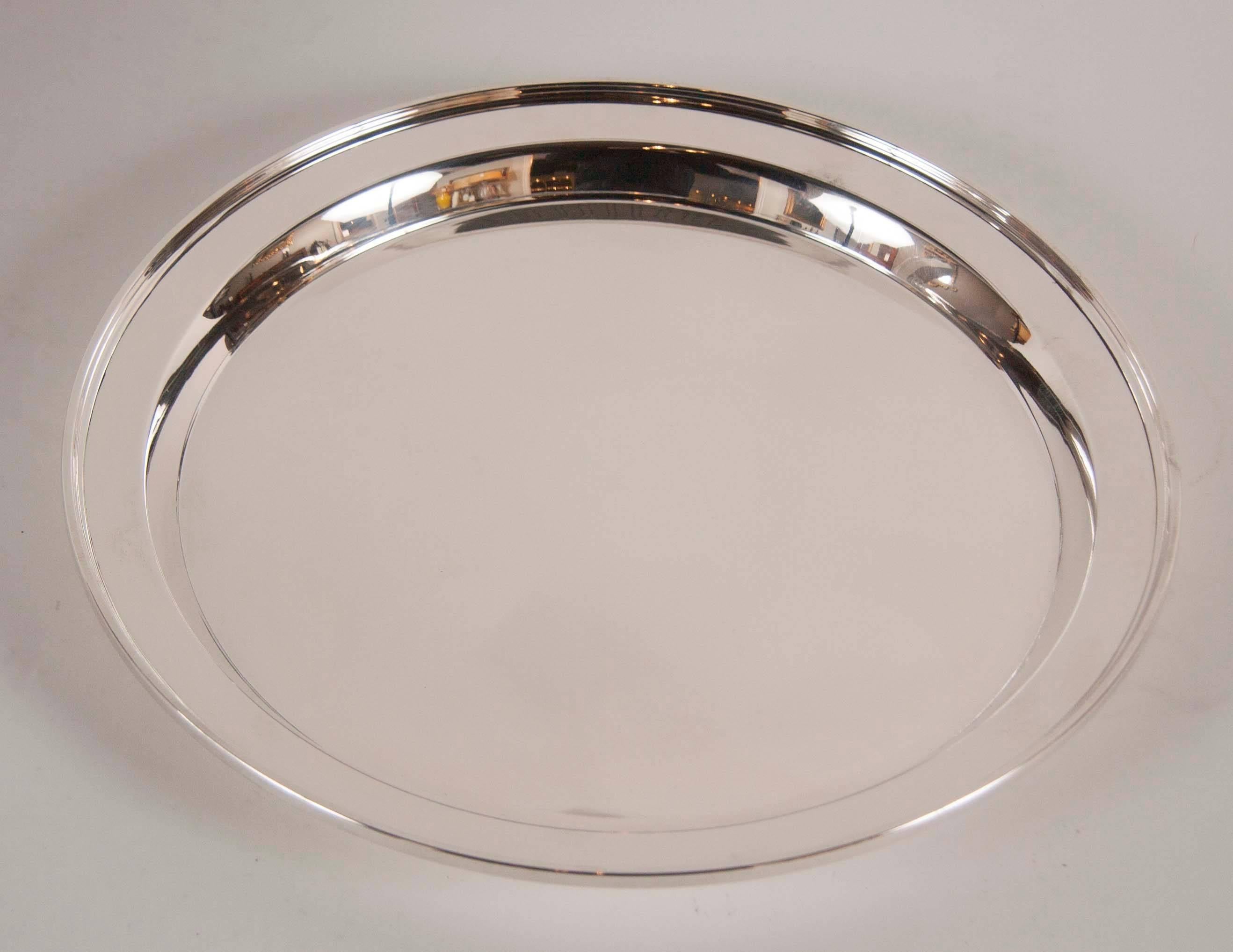 An exceptional pair of Cartier sterling silver deep trimmed serving trays. Marked on bottom.