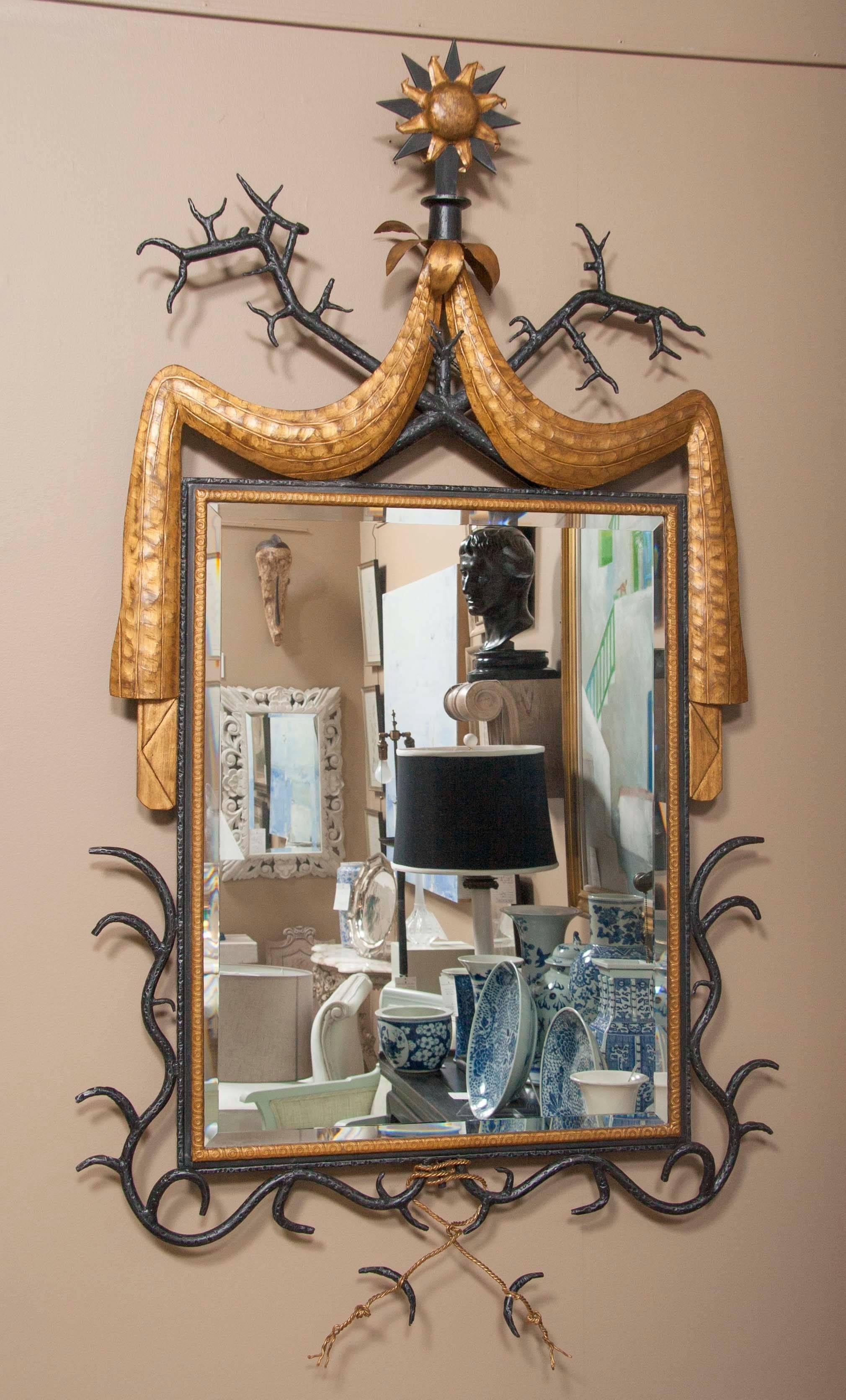An exceptional mid-20th century wrought mirror; painted iron mirror in the manner of Gilbert Poillerat.