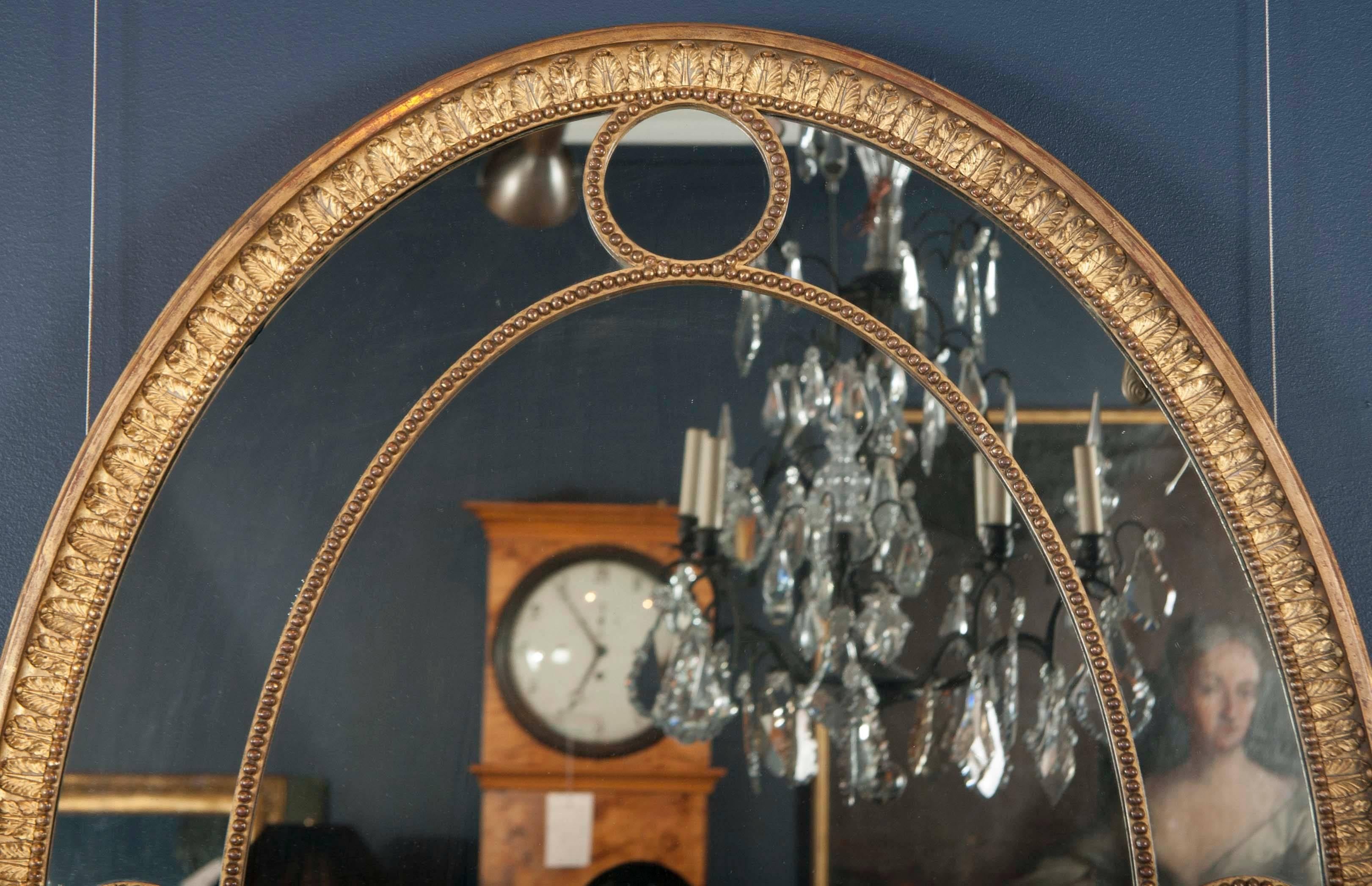 George III Pair of English Oval Giltwood Mirrors