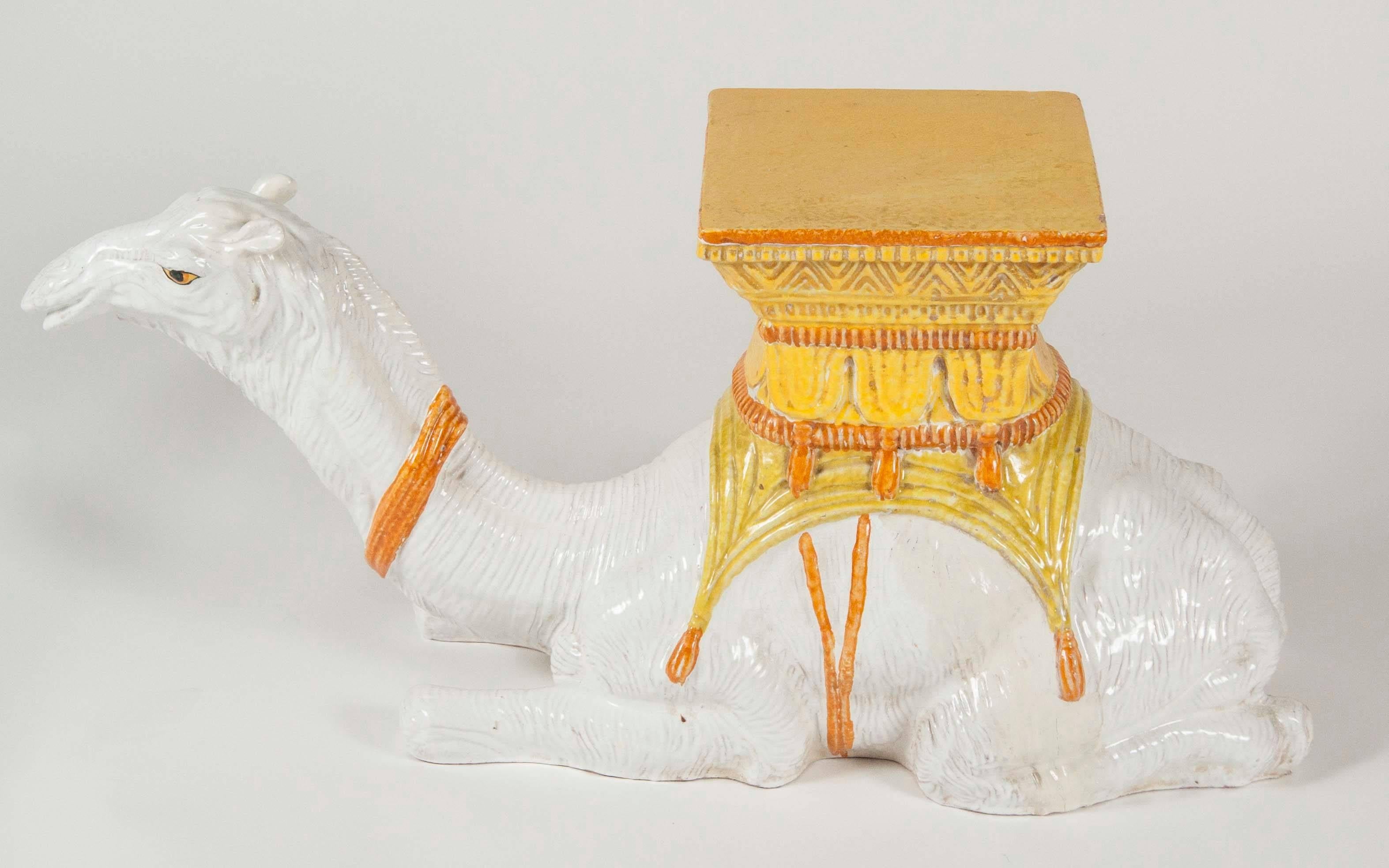 A vintage Italian ceramic garden seat in the shape of a camel.