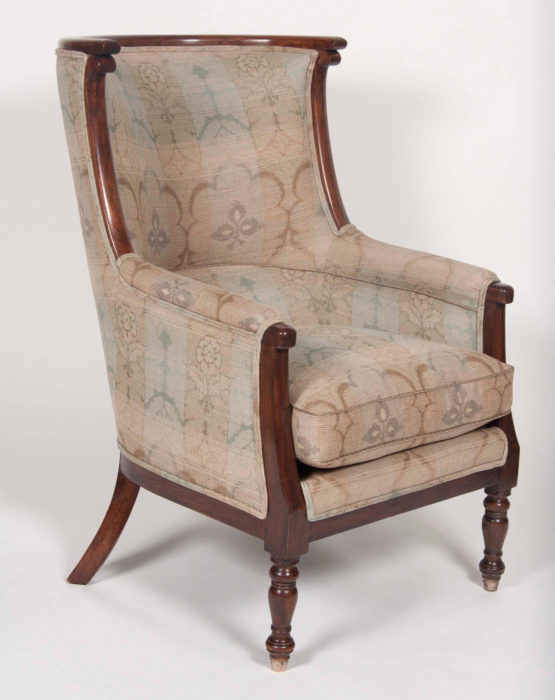 Late French Empire mahogany barrel form chair with turned legs, along with a modern copy. Very deep chair and extremely comfortable.

Completely reupholstered.


 
