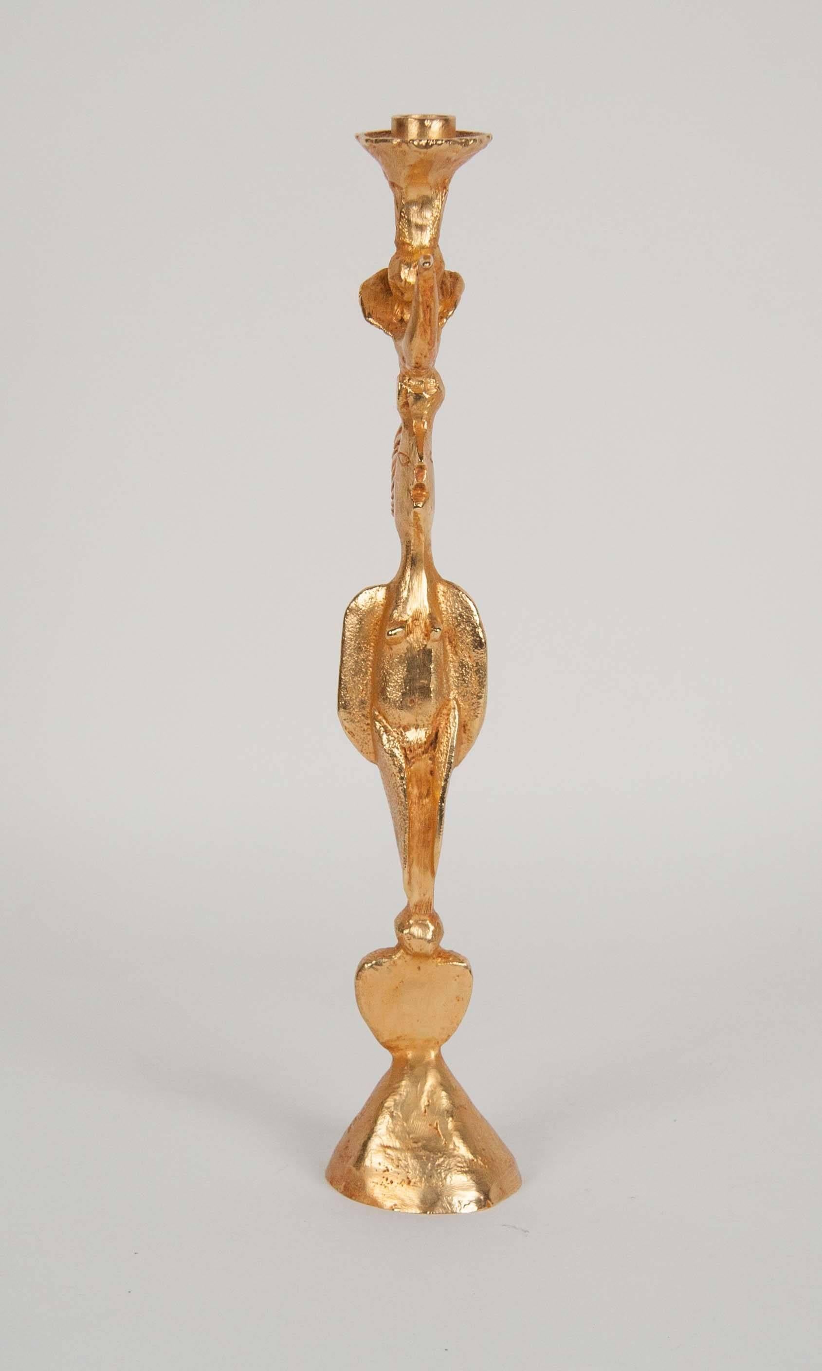 A gilt bronze candlestick by Pierre Casenove for Fondica. Signed.