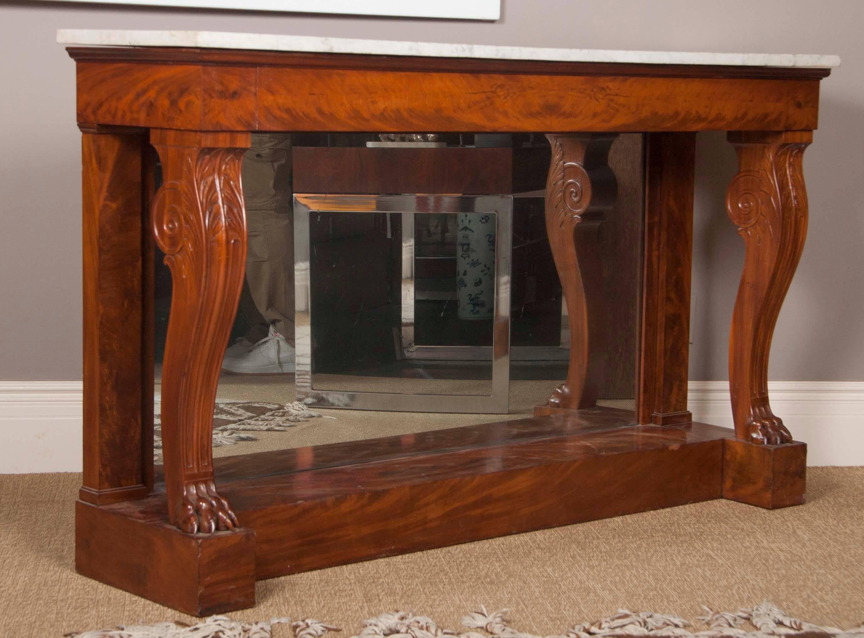 A French marble top console with a mirrored back by François-Honoré-Georges Jacob-Desmalter (French, 1770-1841) . Signed Jacob.