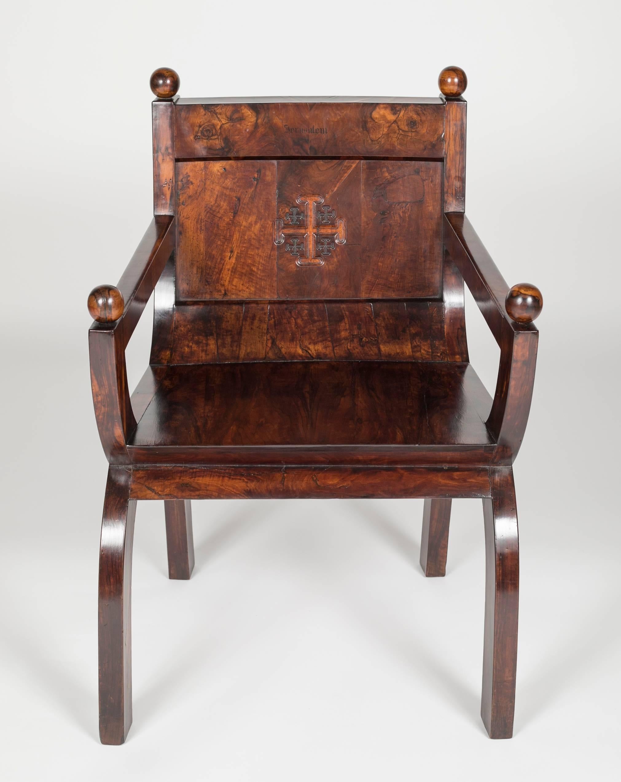 Olivewood Curule form armchair with the Templar symbol of the Jerusalem Cross carved in back.