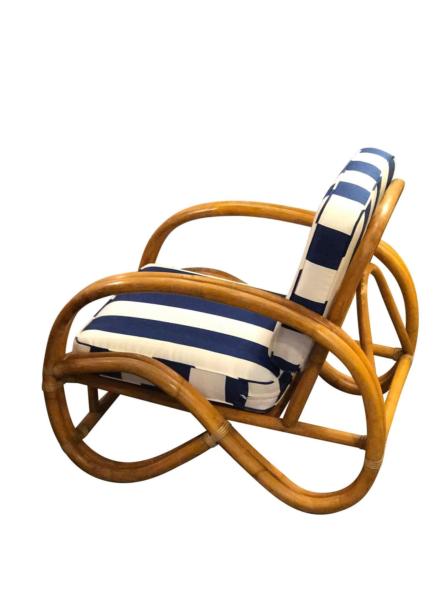 A pair of Paul Frankl style double bamboo Pretzel lounge chairs.


