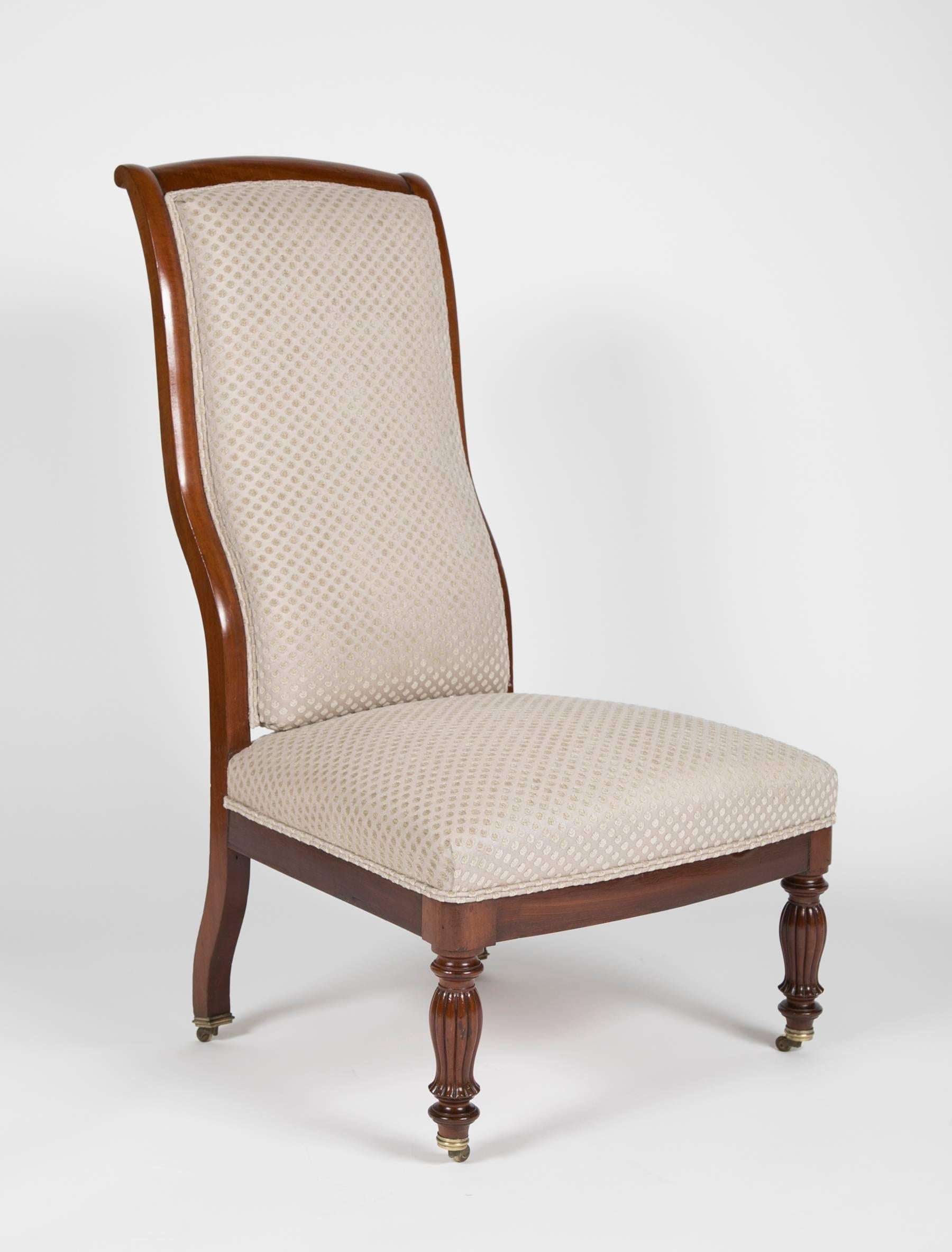A matched pair of French Mahogany chauffeufes/Slipper chairs, circa 1840-1860. Newly upholstered.