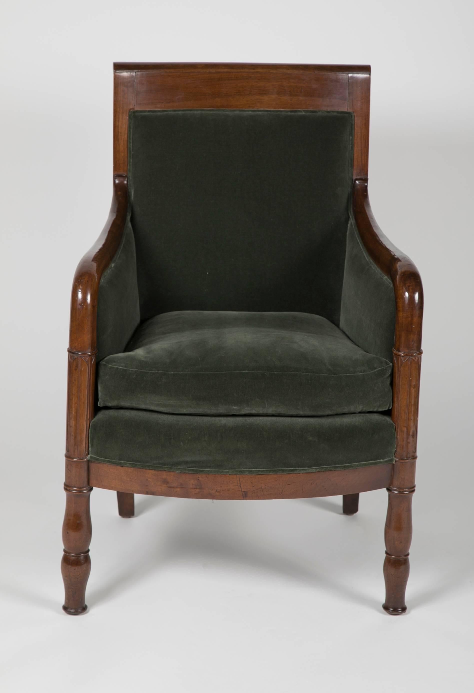 A French mahogany Directoire bergere with velvet upholstery.