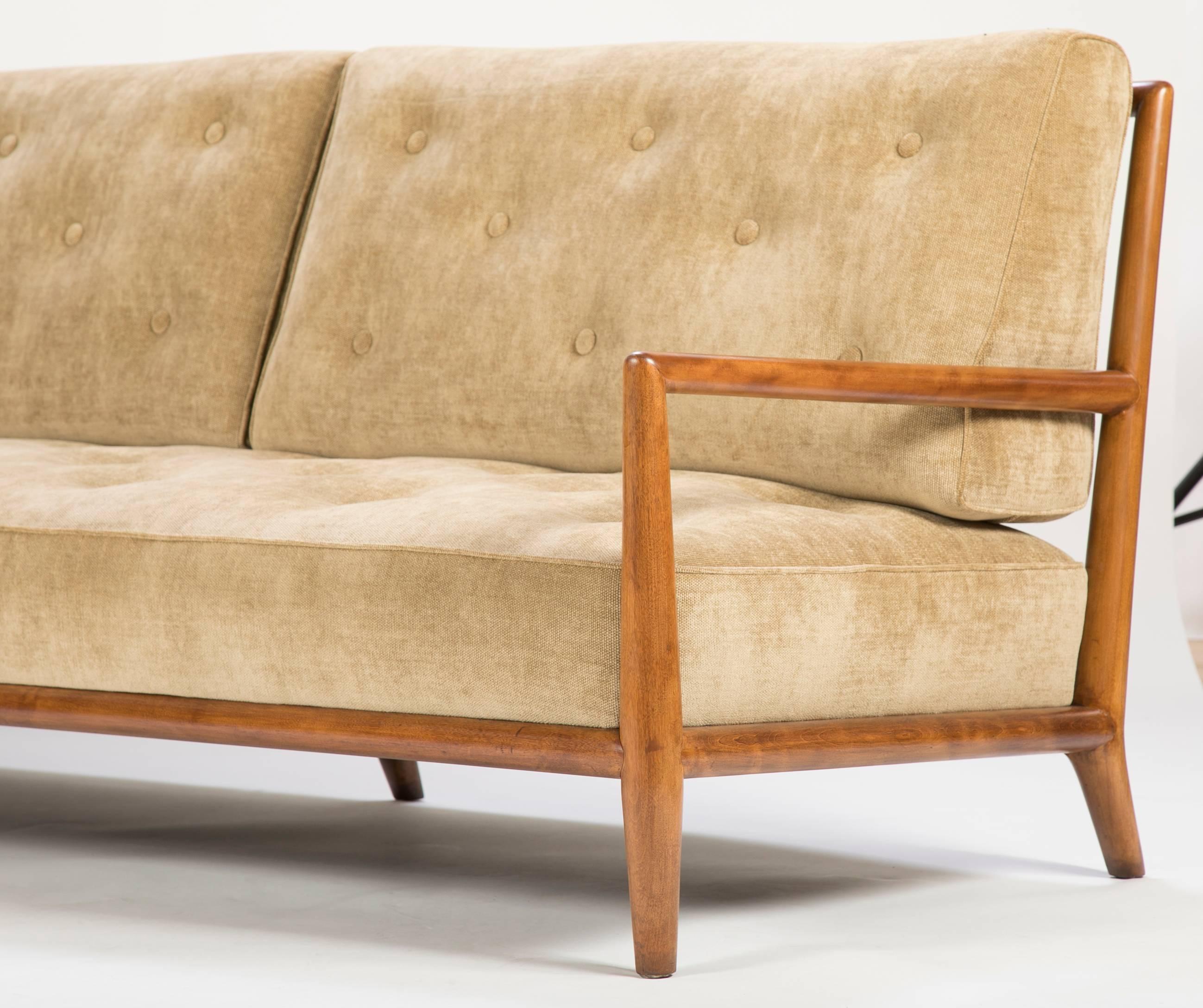 A exposed frame bleached mahogany sofa designed by T.H. Robsjohn-Gibbings for Widdicomb Furniture, circa 1959. Newly upholstered in Rogers & Goffigon fabric.