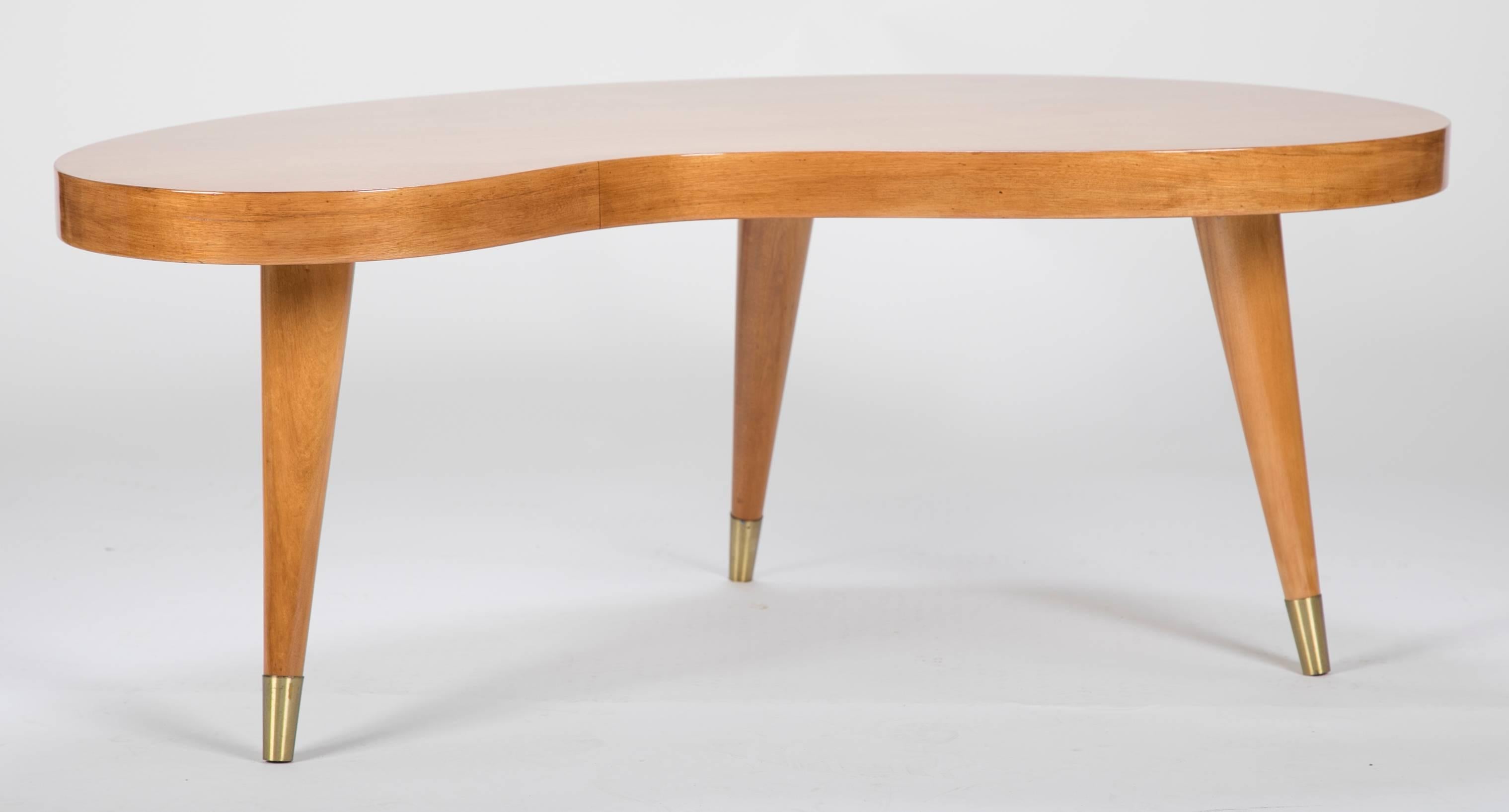 A Mid-Century kidney shaped coffee table.