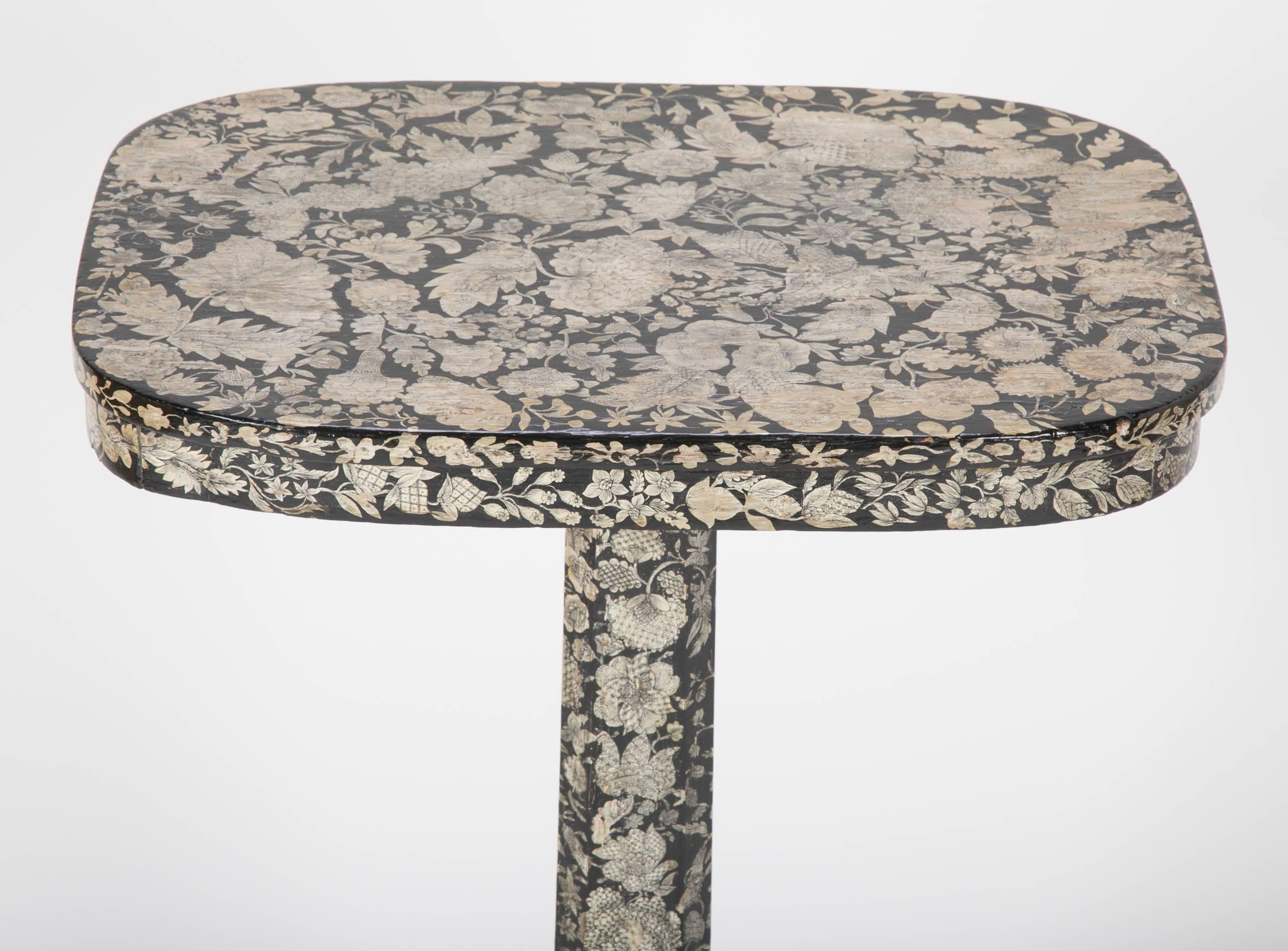A Regency, tilt-top, penwork table with rich floral decoration, England, circa 1800.