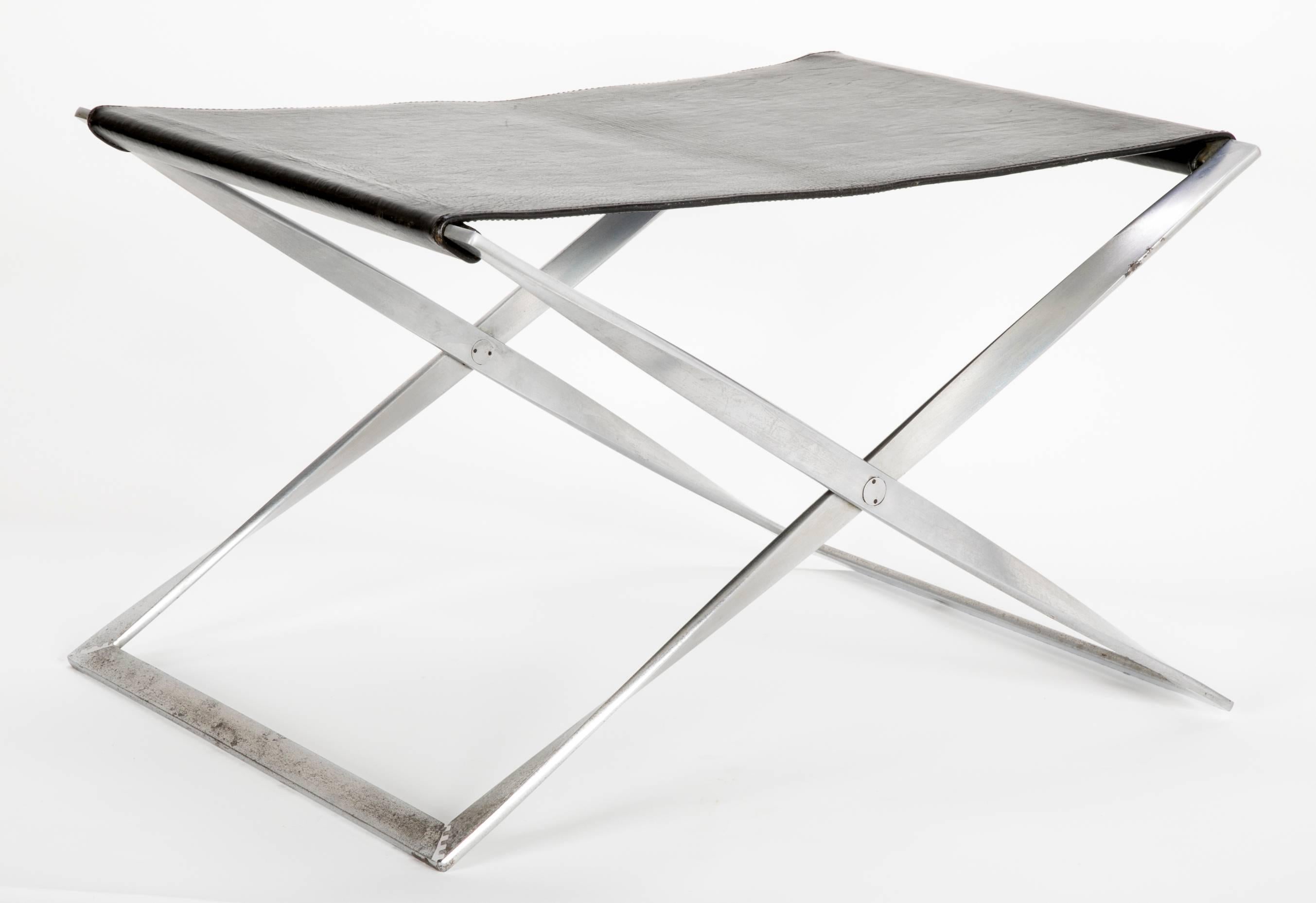 A pair of PK91 stools each stamped EKC inside a square. Please note these are from the first edition of PK91 stools not the latter edition by Fritz Hansen. Matte chrome-plated steel frames with the original goat leather.
For illustrated examples
