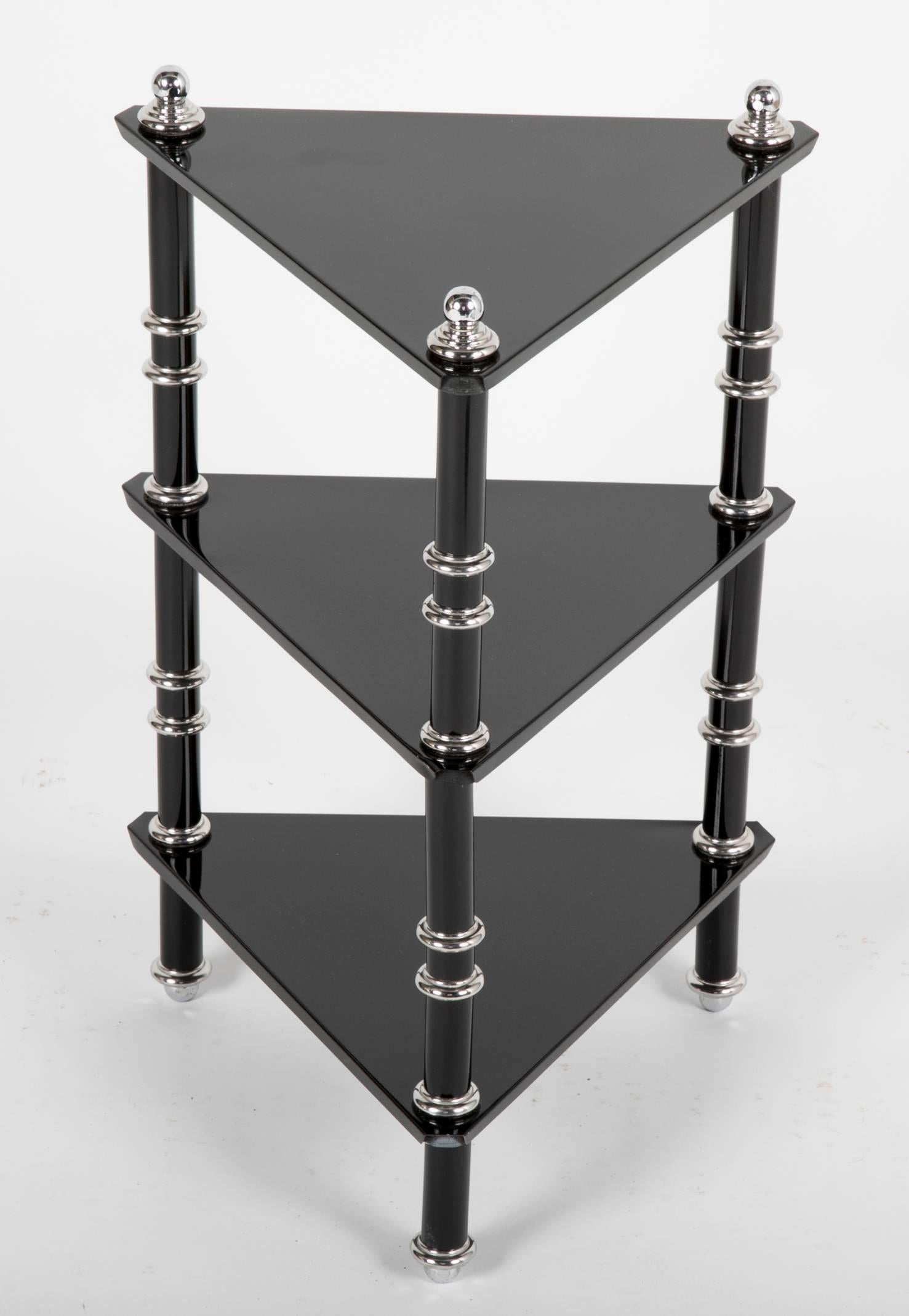 A ebonized and polished Aluminum side table by Warren McArthur. This side table is almost certainly from 1929, showing the prevalence of the triangle in McArthurs work around the time that he did the interior furniture for the Arizona Biltmore.