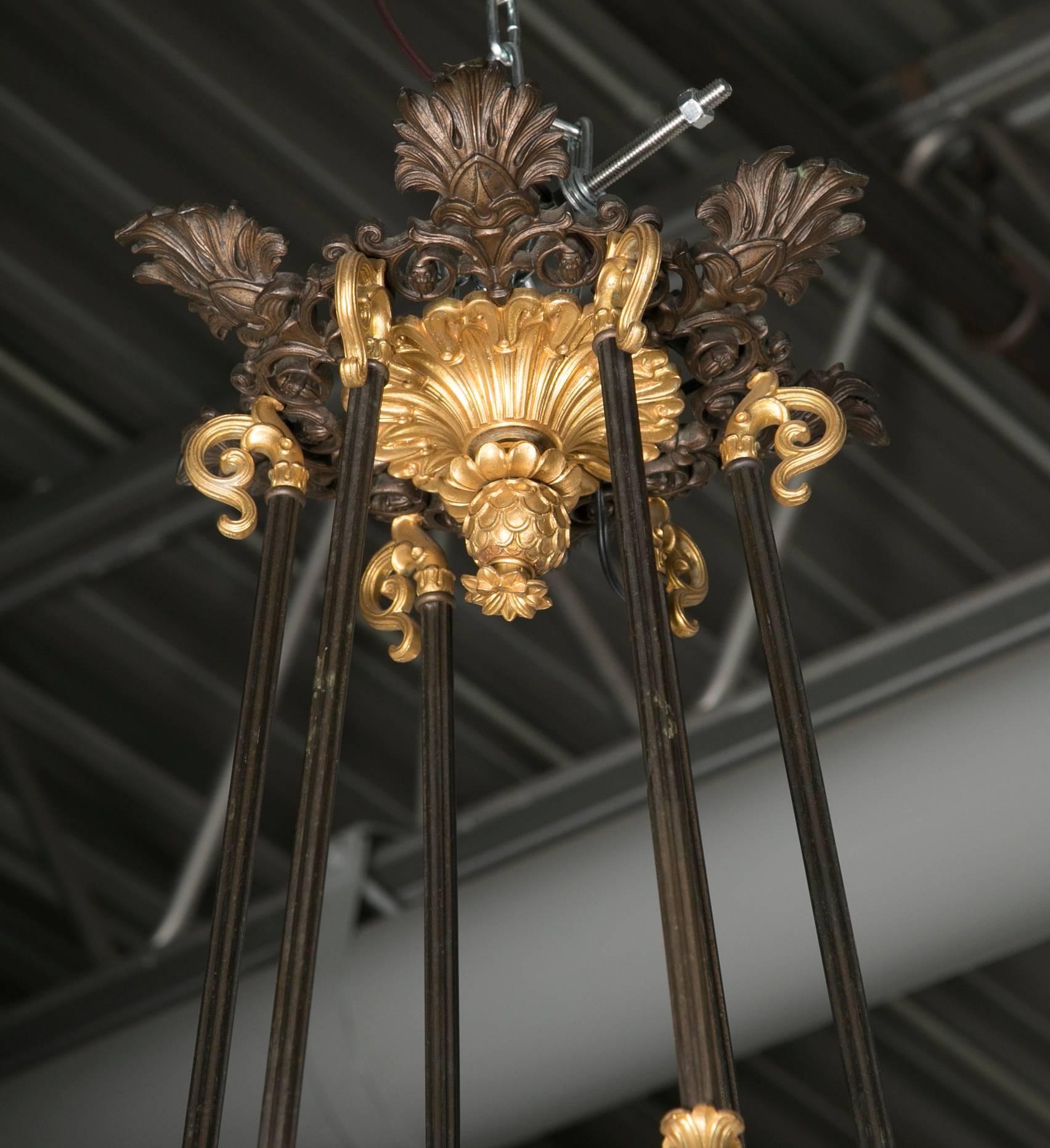 French Palatial D'Ore and Patinated Bronze Napoleonic Twelve-Light Chandelier For Sale