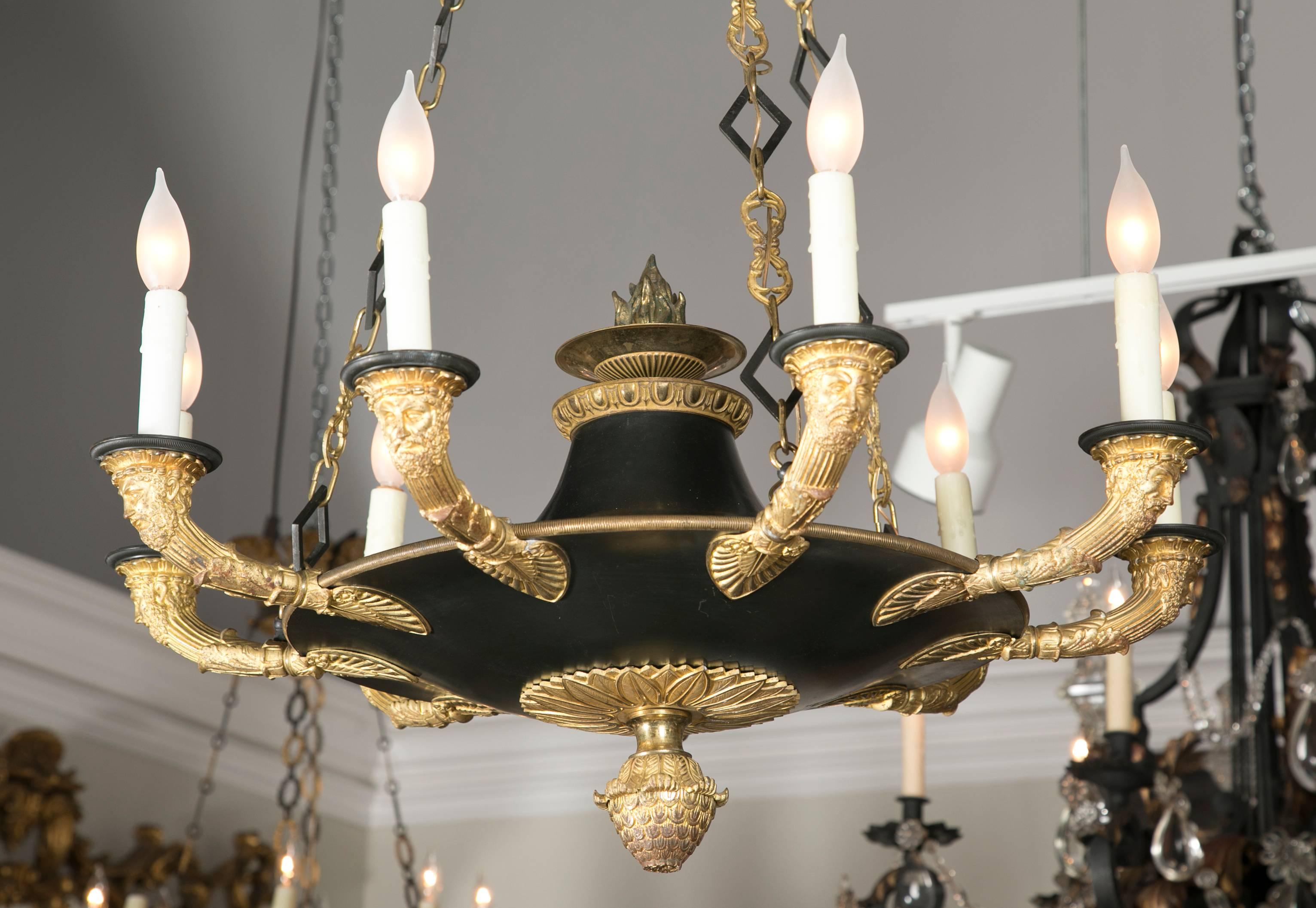 Wonderful chateau quality d'ore gilt and patinated bronze 9 light chandelier.  Provenance : Andrew Hall estate, Southport, CT.