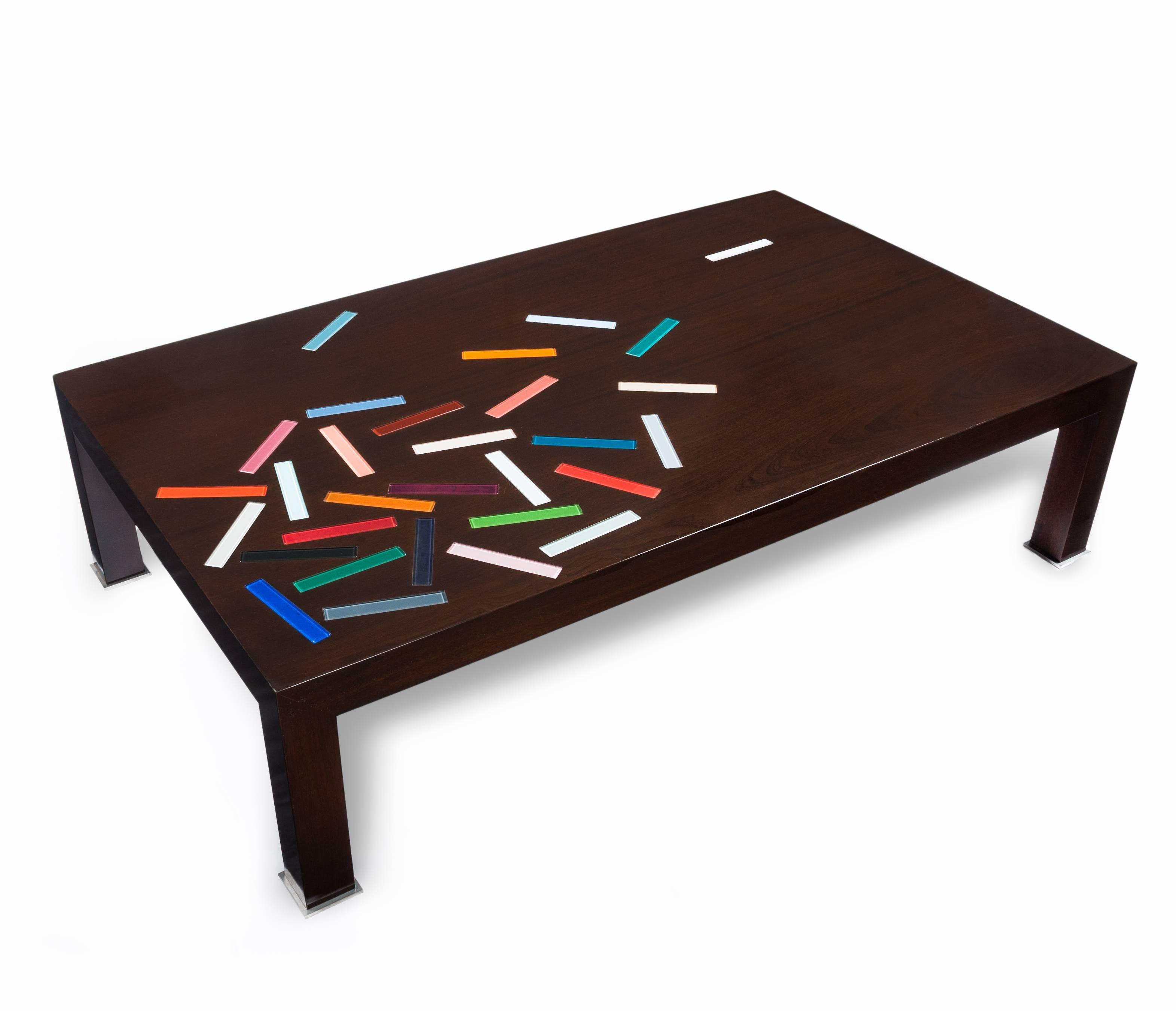 A one-of-a-kind sapele mahogany coffee table with various colored-glass pieces inlaid in the surface. Created by A. M. Krieger in 2014.