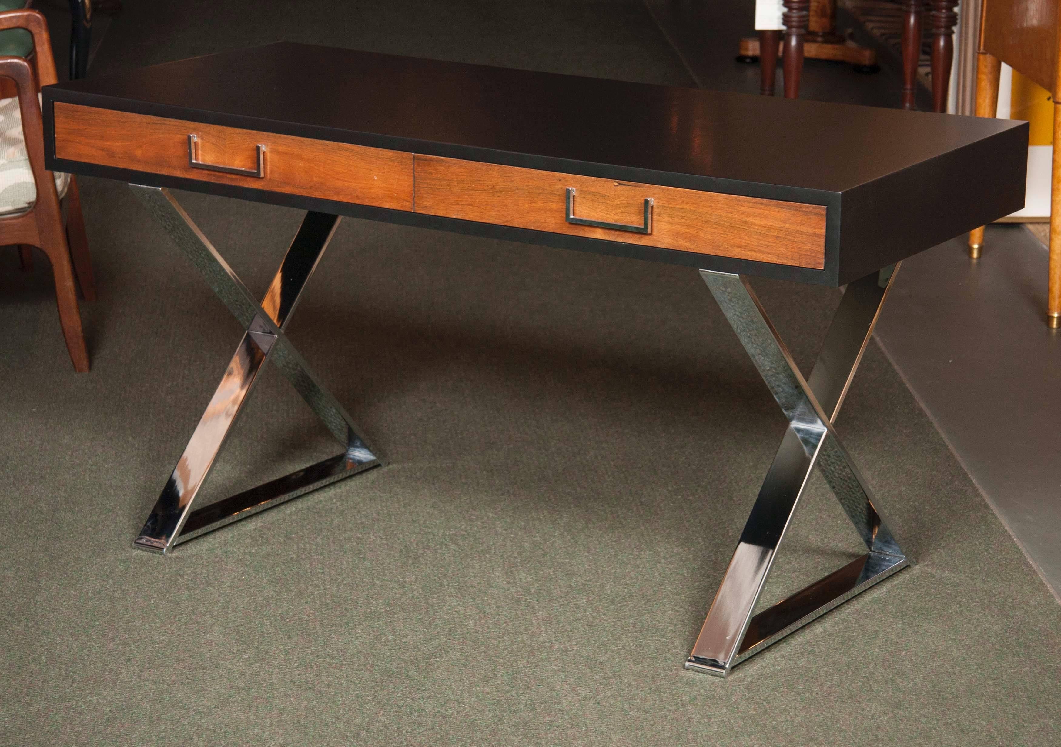 A campaign desk with lacquered top and polished aluminum legs by West Michigan Furniture.