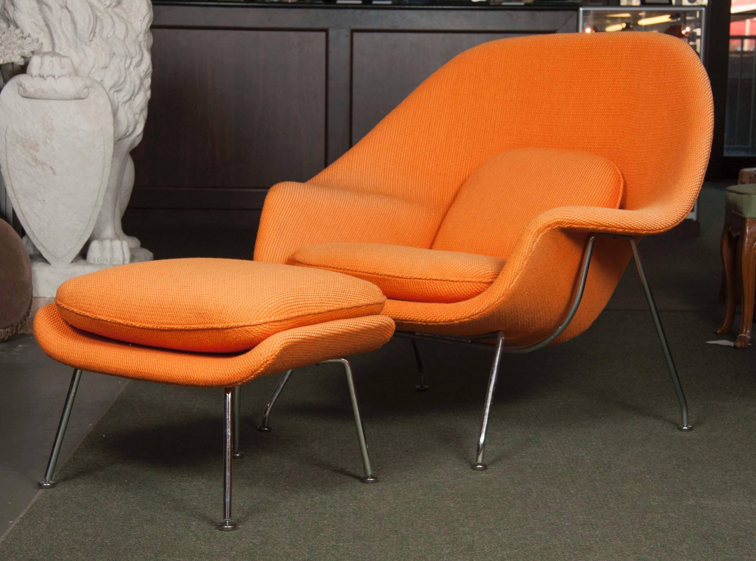 Great Eero Saarinen 'Womb' chair and ottoman for Knoll of plated steel and light orange upholstery.
Seat height: 16