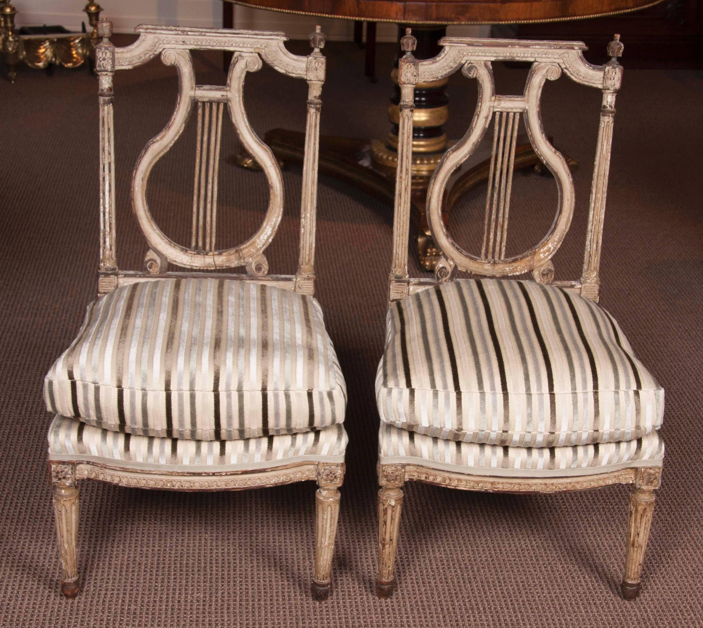 Pair of Directoire painted chaises A la Reine.